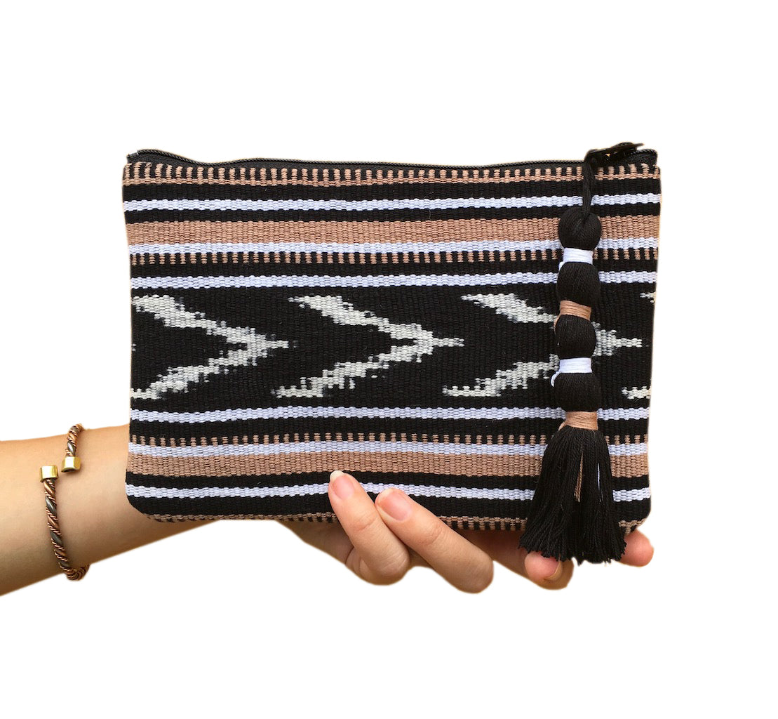 Ikat Backstrap Clutch featuring vibrant tribal patterns, handmade by Guatemalan artisans, showcasing traditional weaving techniques.