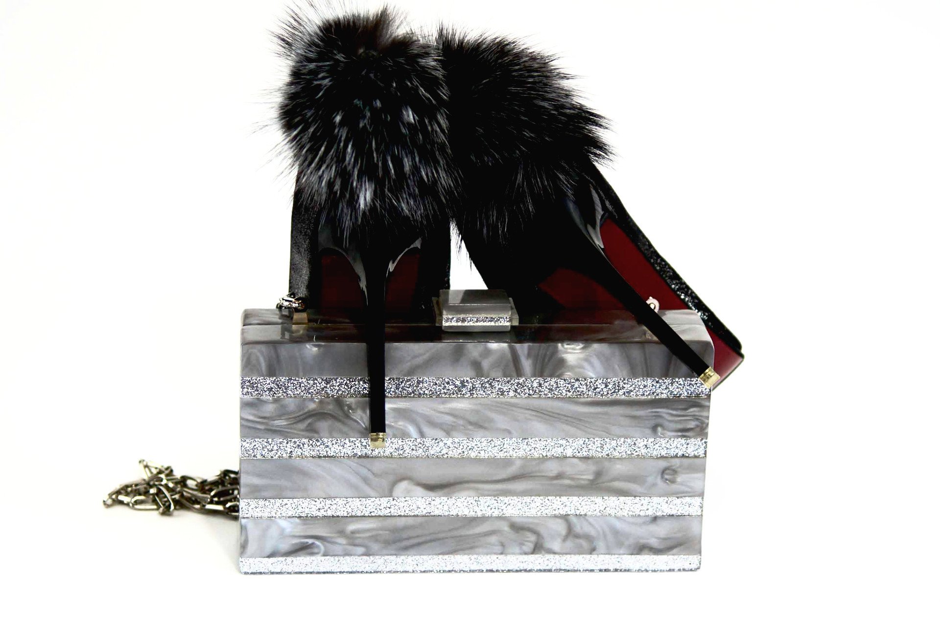 Marble Silver Stripe Box Clutch featuring a chic marble pattern and silver glitter stripe, with a satin-lined interior and a stylish chain.