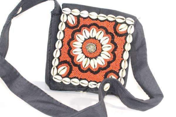 Marigold Vintage Cowrie Shell & Bead Work Cross Body Purse featuring colorful patterns, real shells, and shiny seed beads, perfect for casual outings.