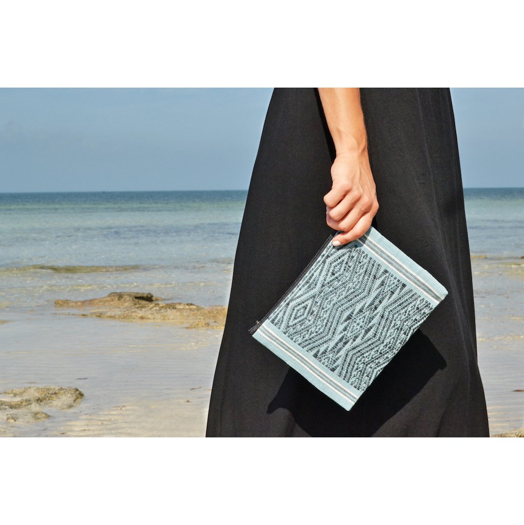 Ocean Tribal Clutch, handwoven with traditional patterns, featuring a zippered closure and lined interior, showcasing sustainable craftsmanship from Laos.