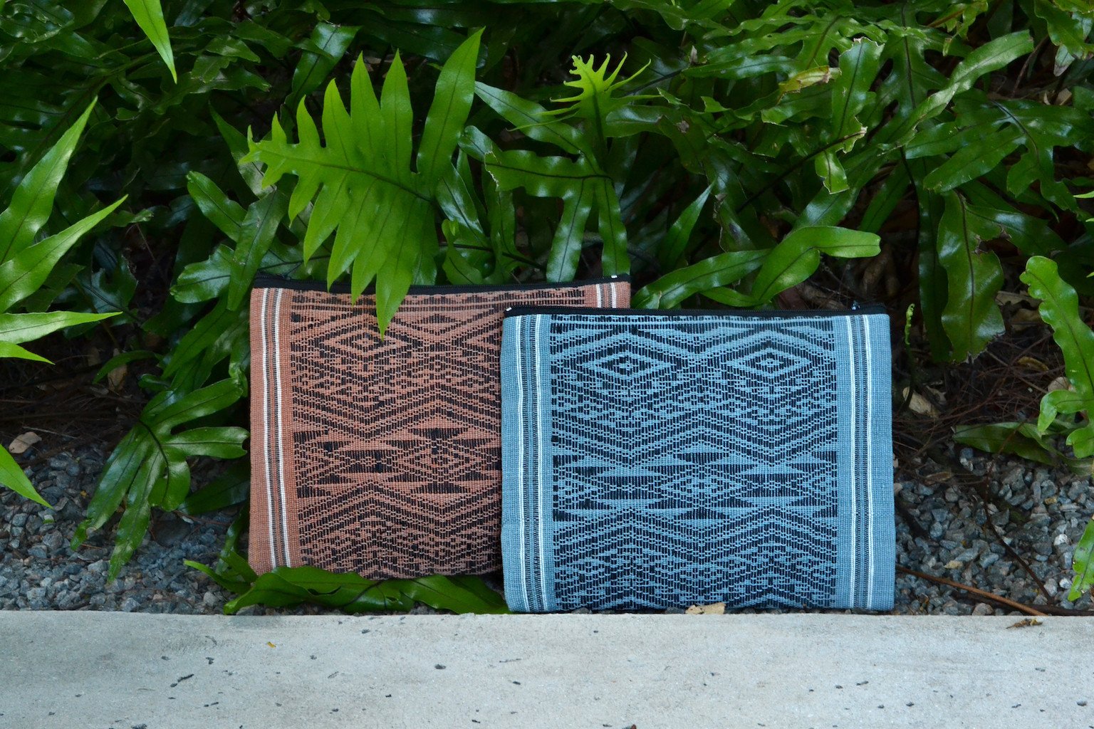 Ocean Tribal Clutch, handwoven with traditional patterns, featuring a zippered closure and lined interior, showcasing sustainable craftsmanship from Laos.