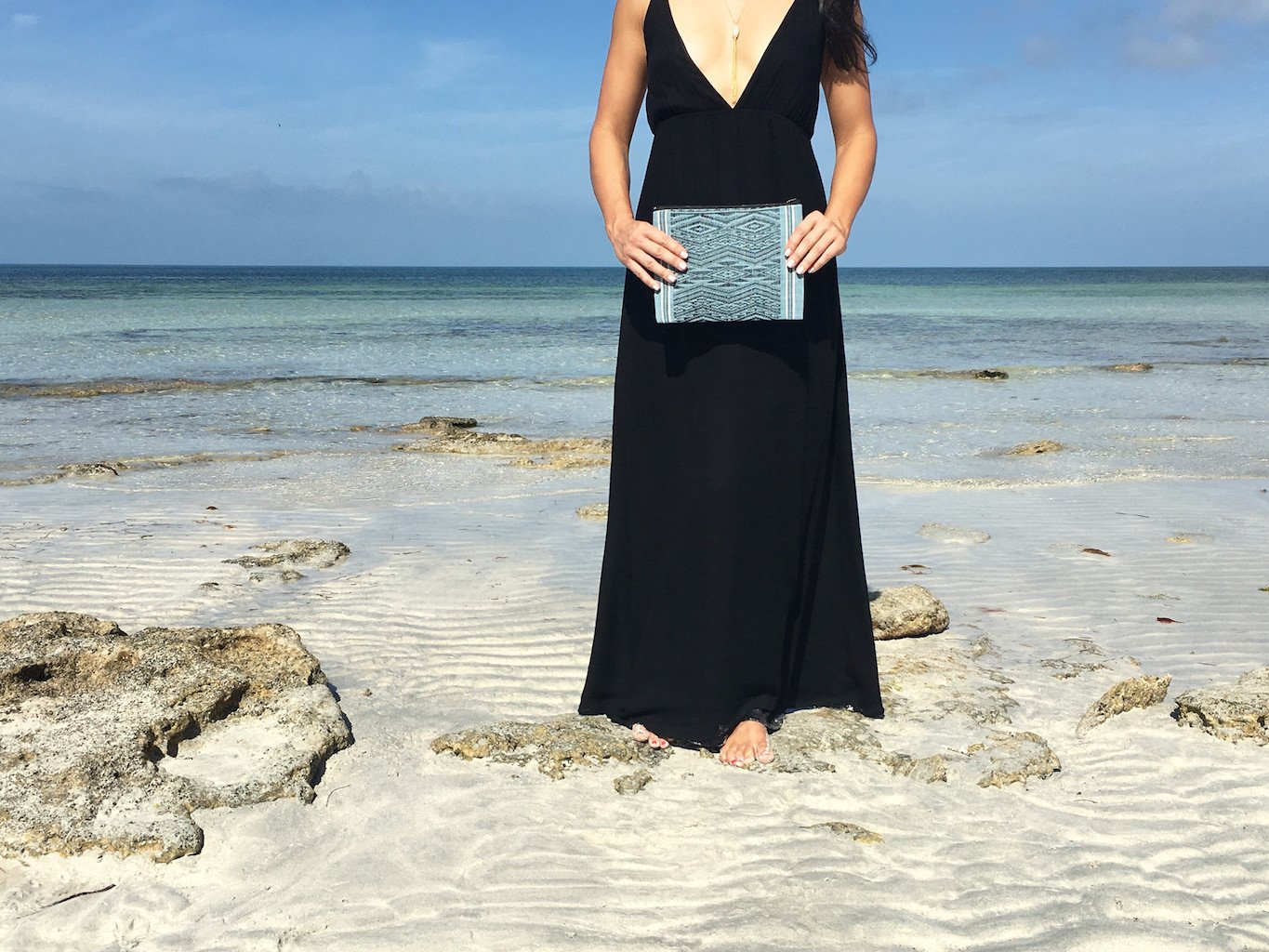 Ocean Tribal Clutch, handwoven with traditional patterns, featuring a zippered closure and lined interior, showcasing sustainable craftsmanship from Laos.