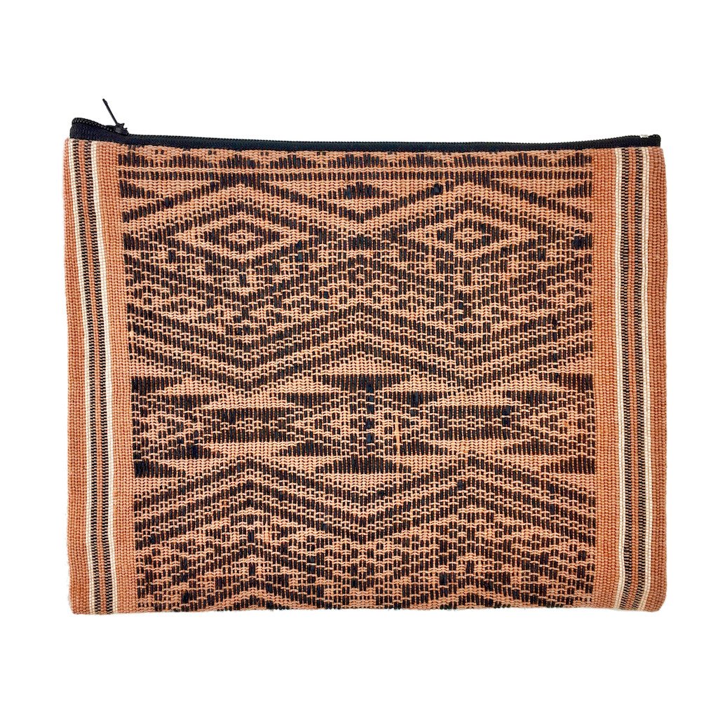 Sierra Tribal Clutch, handwoven from Saa material, featuring tribal patterns and a zippered closure, perfect for various occasions.