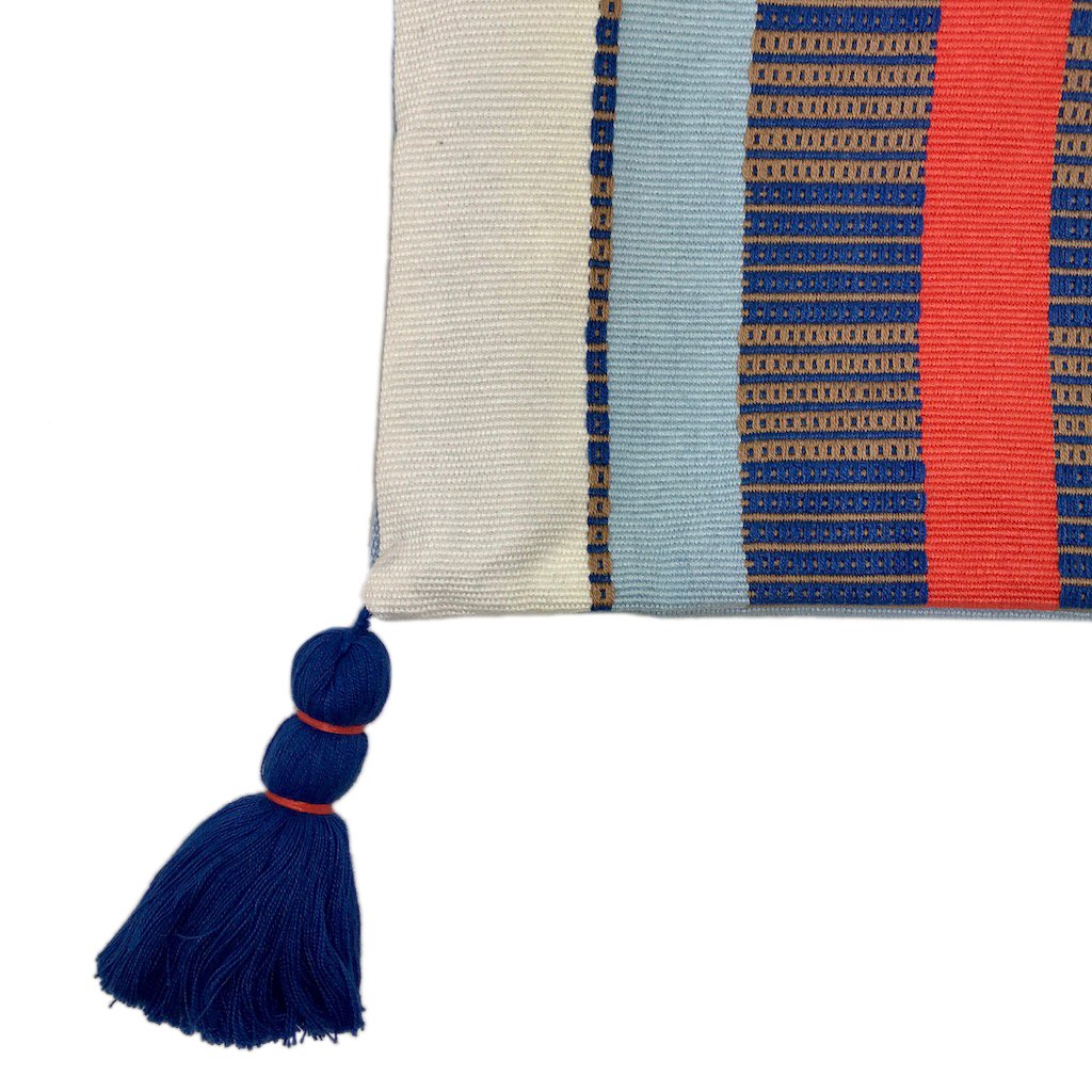 White Striped Backstrap Clutch handmade from cotton, featuring vibrant stripes and tassels, showcasing traditional Guatemalan weaving techniques.