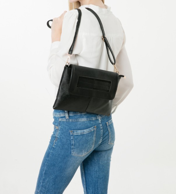 Womens Vegan Leather Envelope Clutch Bag in black, showcasing its sleek design and adjustable strap.