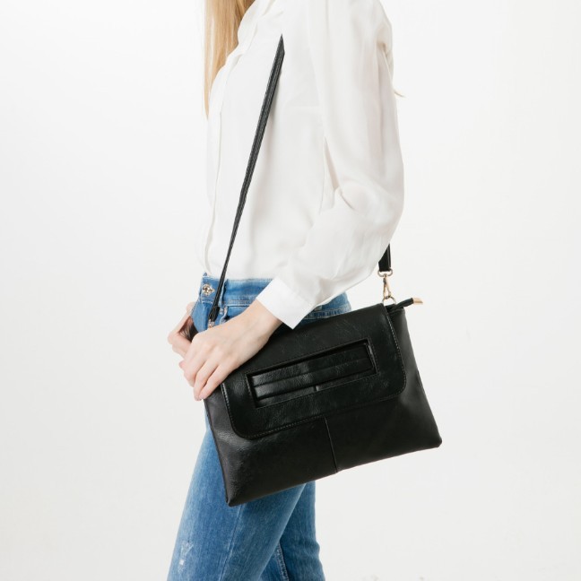 Womens Vegan Leather Envelope Clutch Bag in black, showcasing its sleek design and adjustable strap.