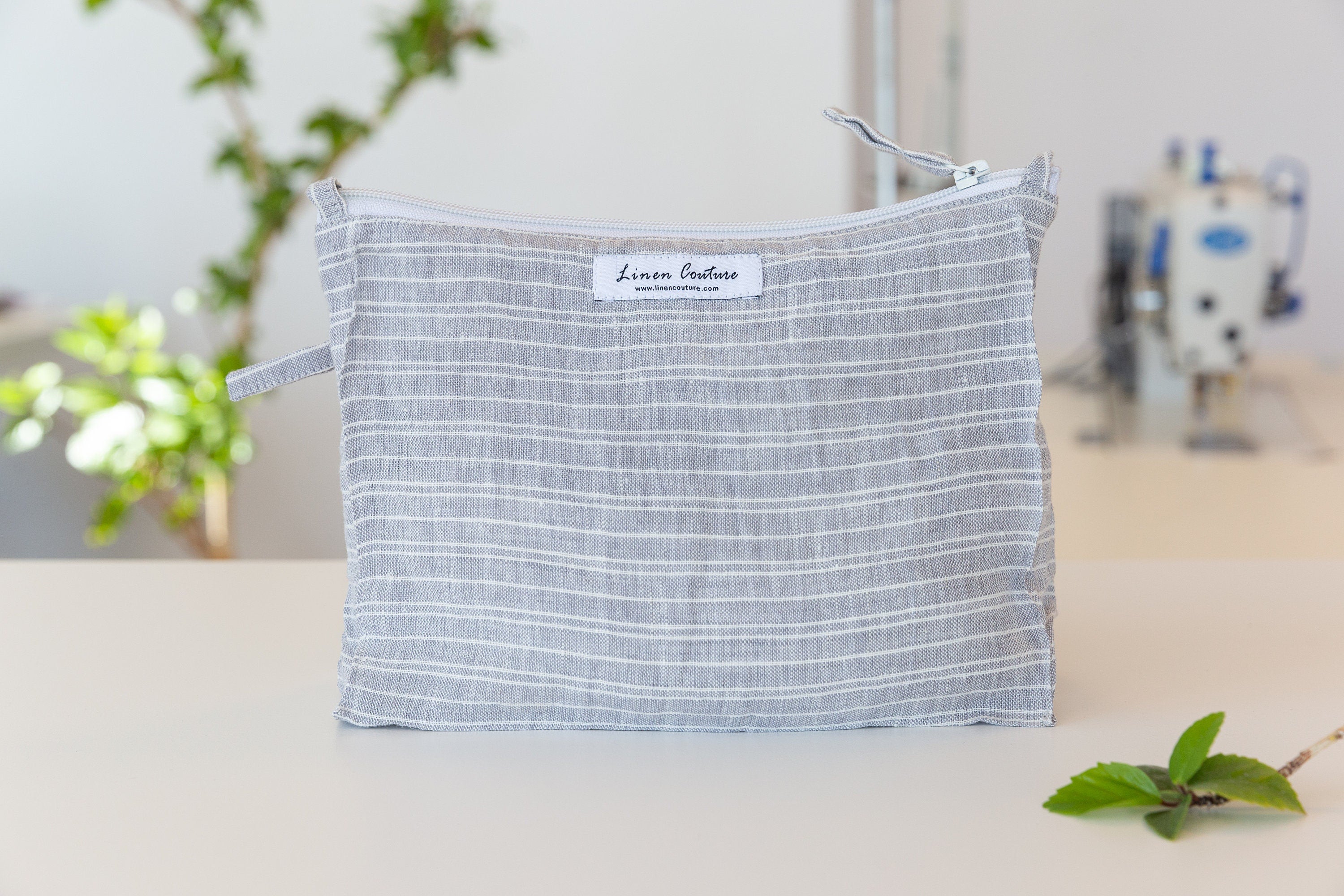 Baby Blue linen large makeup bag with zipper closure, showcasing its elegant design and soft texture, perfect for organizing essentials.