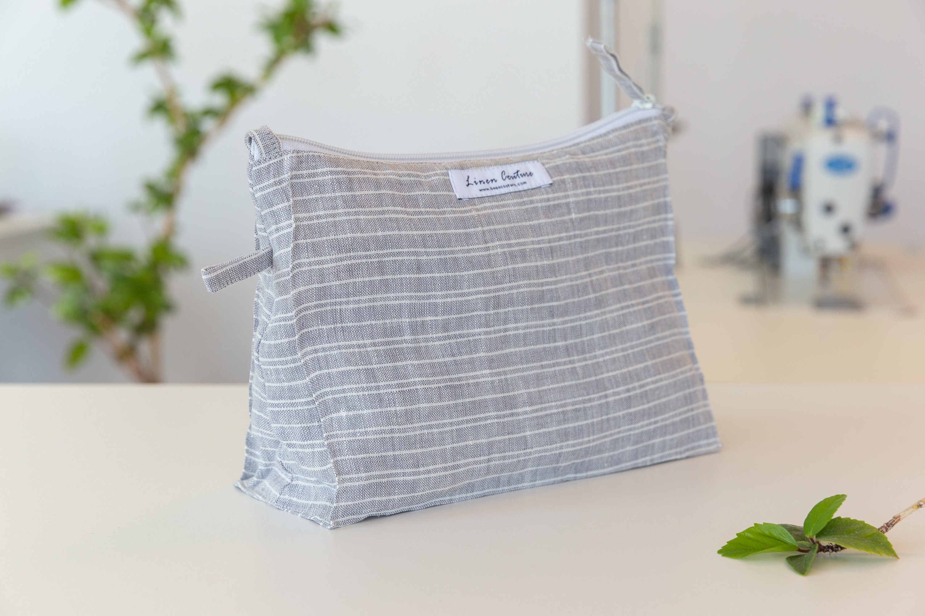 Baby Blue linen large makeup bag with zipper closure, showcasing its elegant design and soft texture, perfect for organizing essentials.