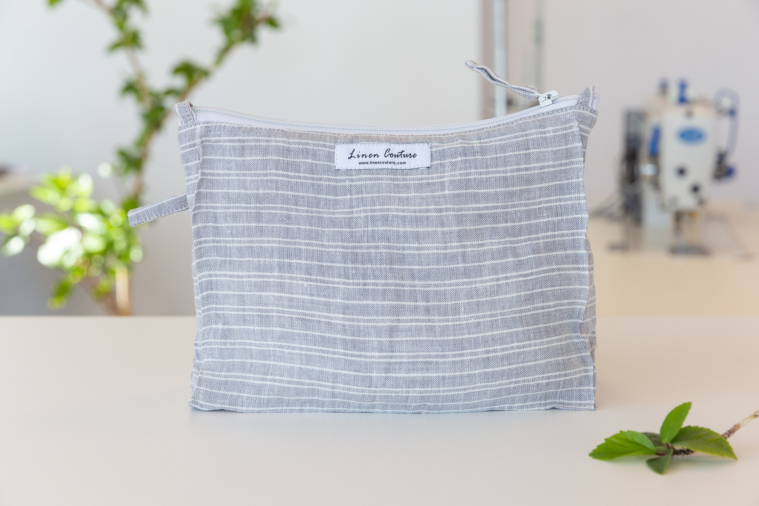 Cloudy Grey Stripe linen large makeup bag with zipper closure, showcasing its elegant design and soft texture, perfect for organizing essentials.