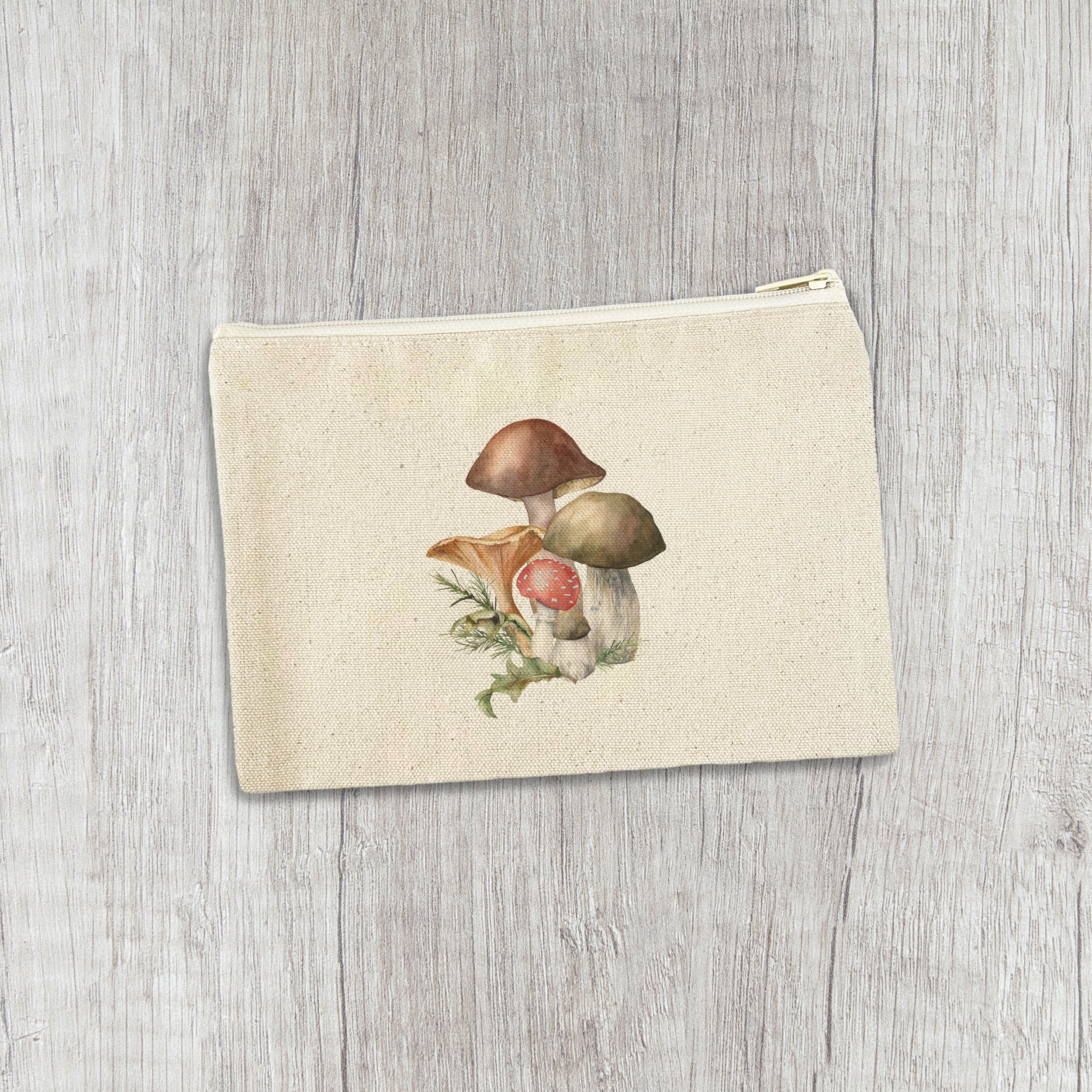 Forest Mushrooms canvas zipper pouch featuring a cute mushroom design and natural color zipper, made from durable cotton canvas.