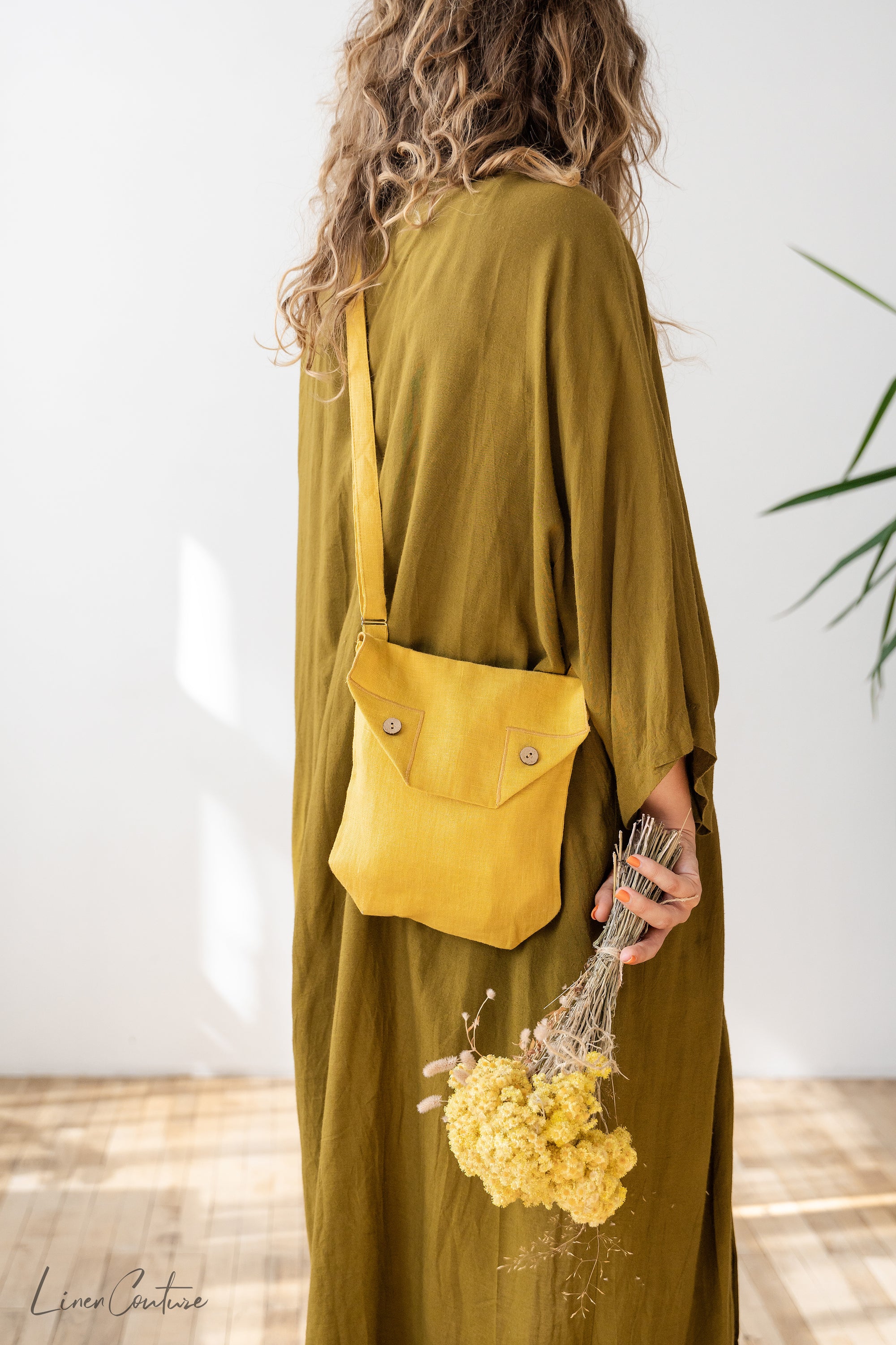 Honey Linen Shoulder Bag featuring coconut buttons and an adjustable strap, showcasing its elegant design and quality linen fabric.