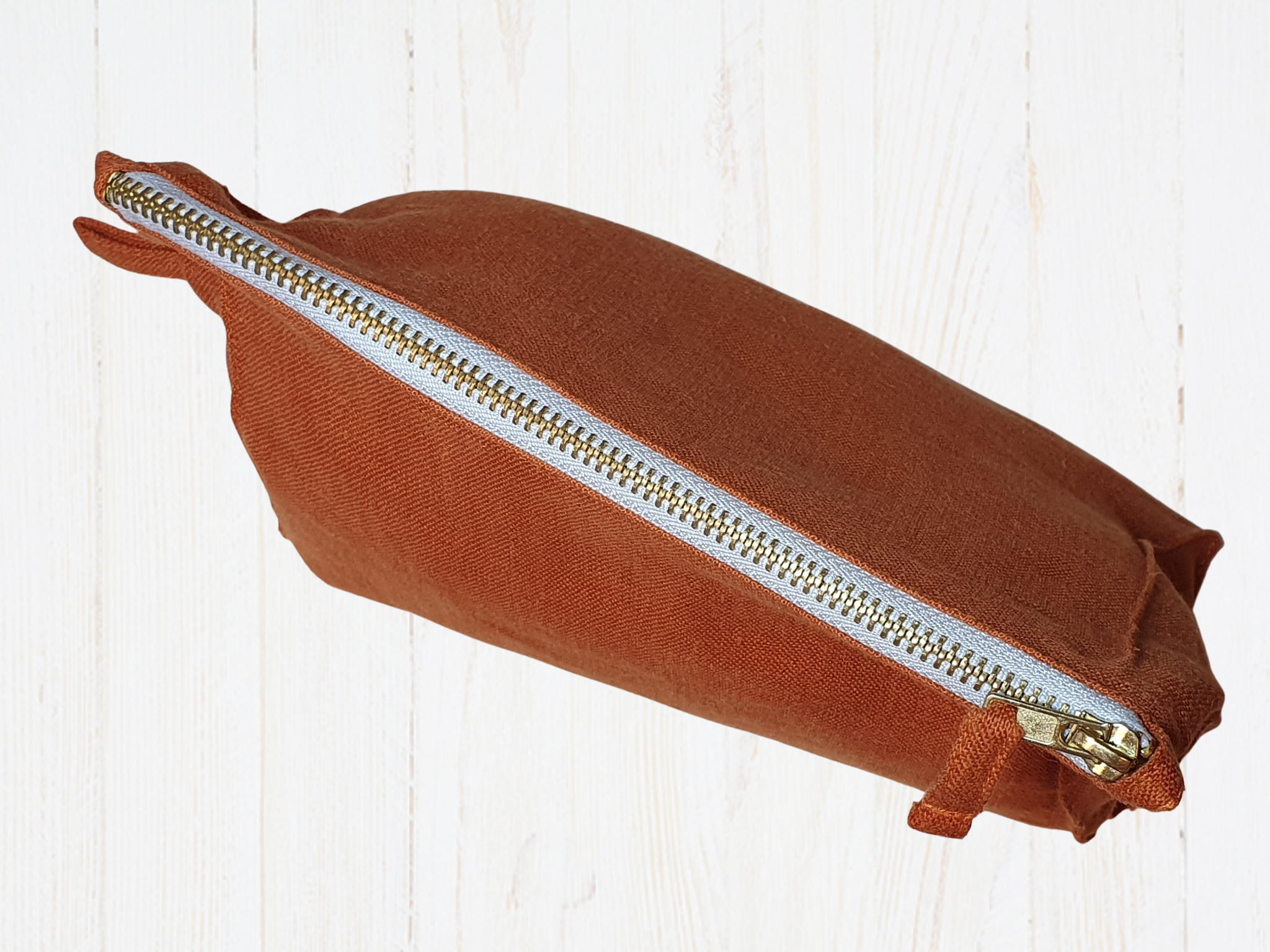 Light Chestnut linen toiletry bag with zipper, showcasing its soft texture and stylish design, perfect for travel and organization.