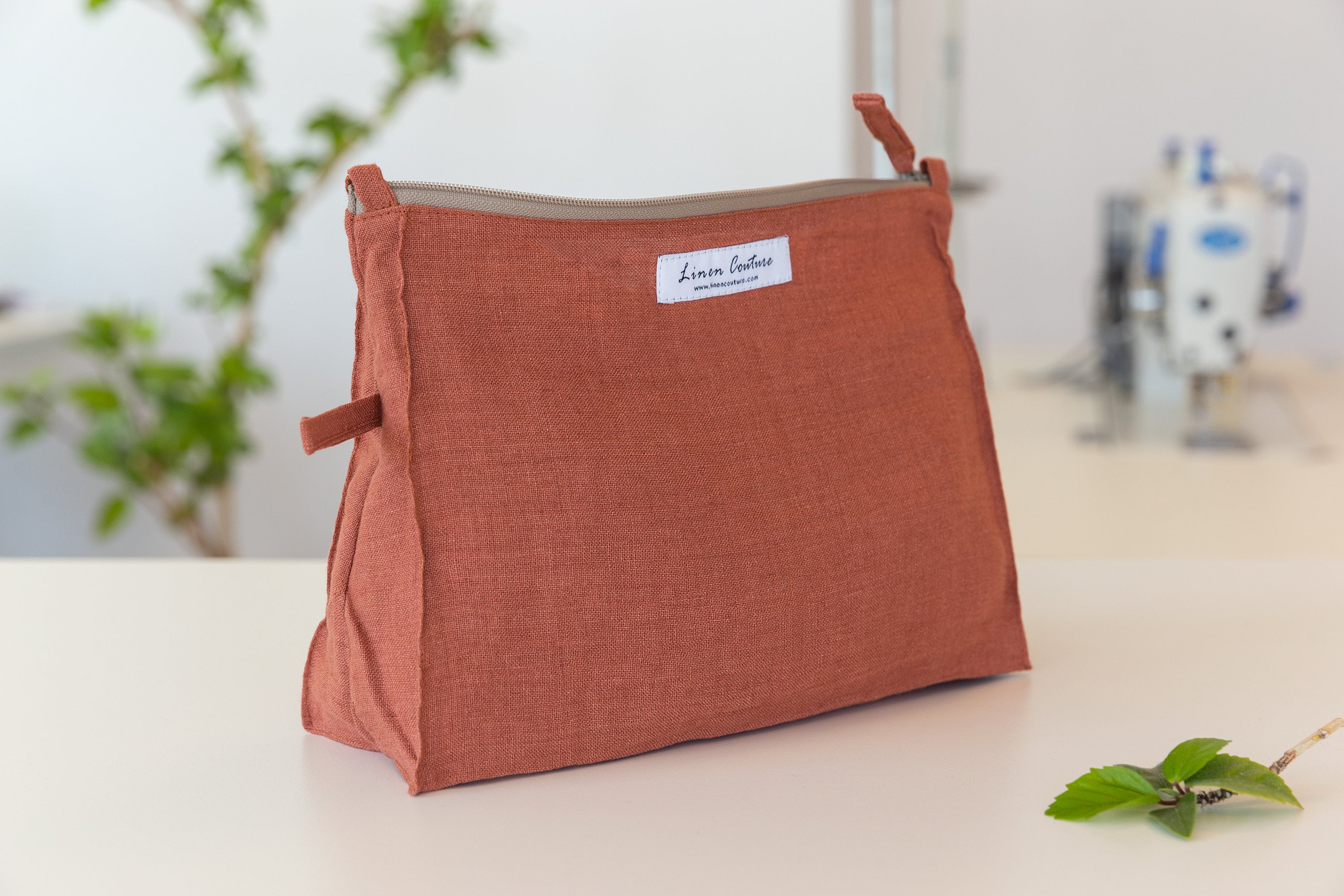 Melange Burgundy linen large makeup bag with zipper closure, showcasing its elegant design and soft texture, perfect for organizing makeup and toiletries.