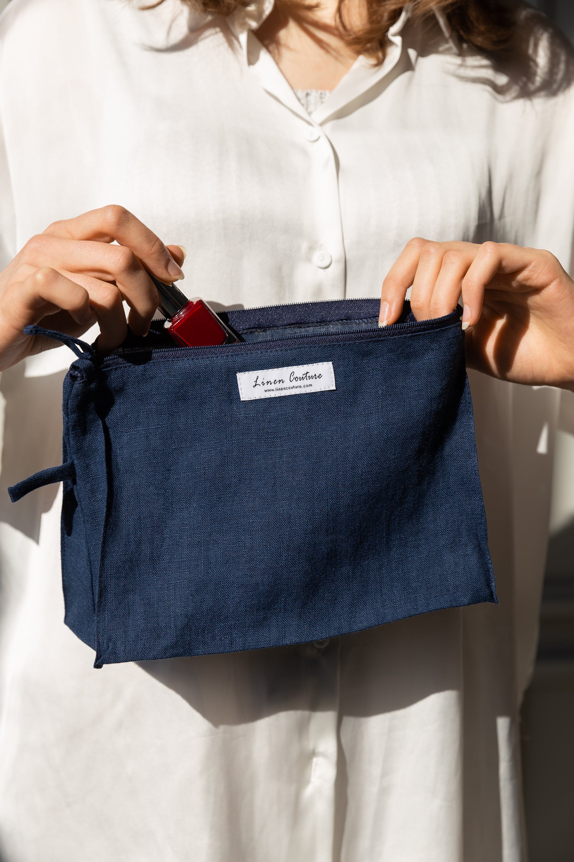 Night Blue linen large makeup bag with zipper, showcasing its elegant design and practical size for organizing essentials.