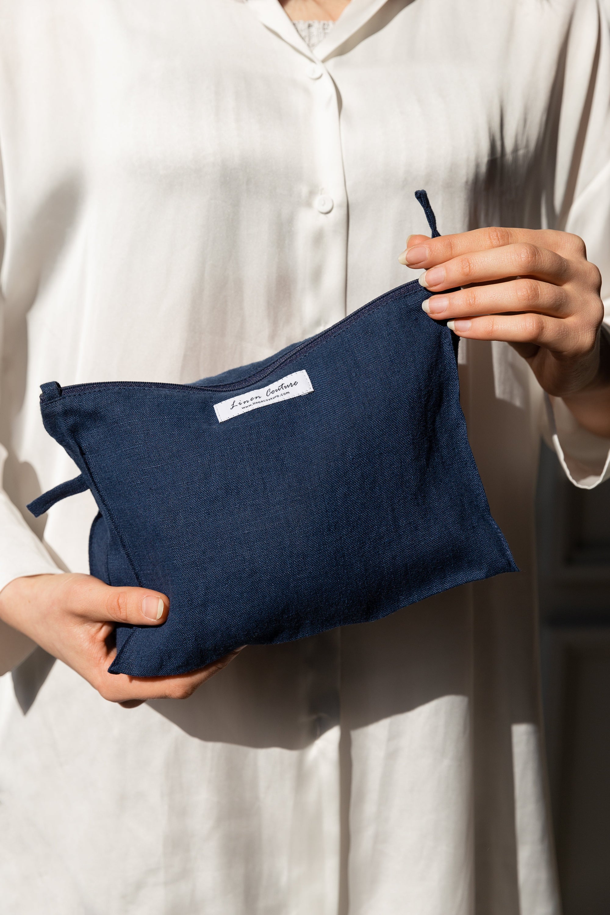 Night Blue linen large makeup bag with zipper, showcasing its elegant design and practical size for organizing essentials.