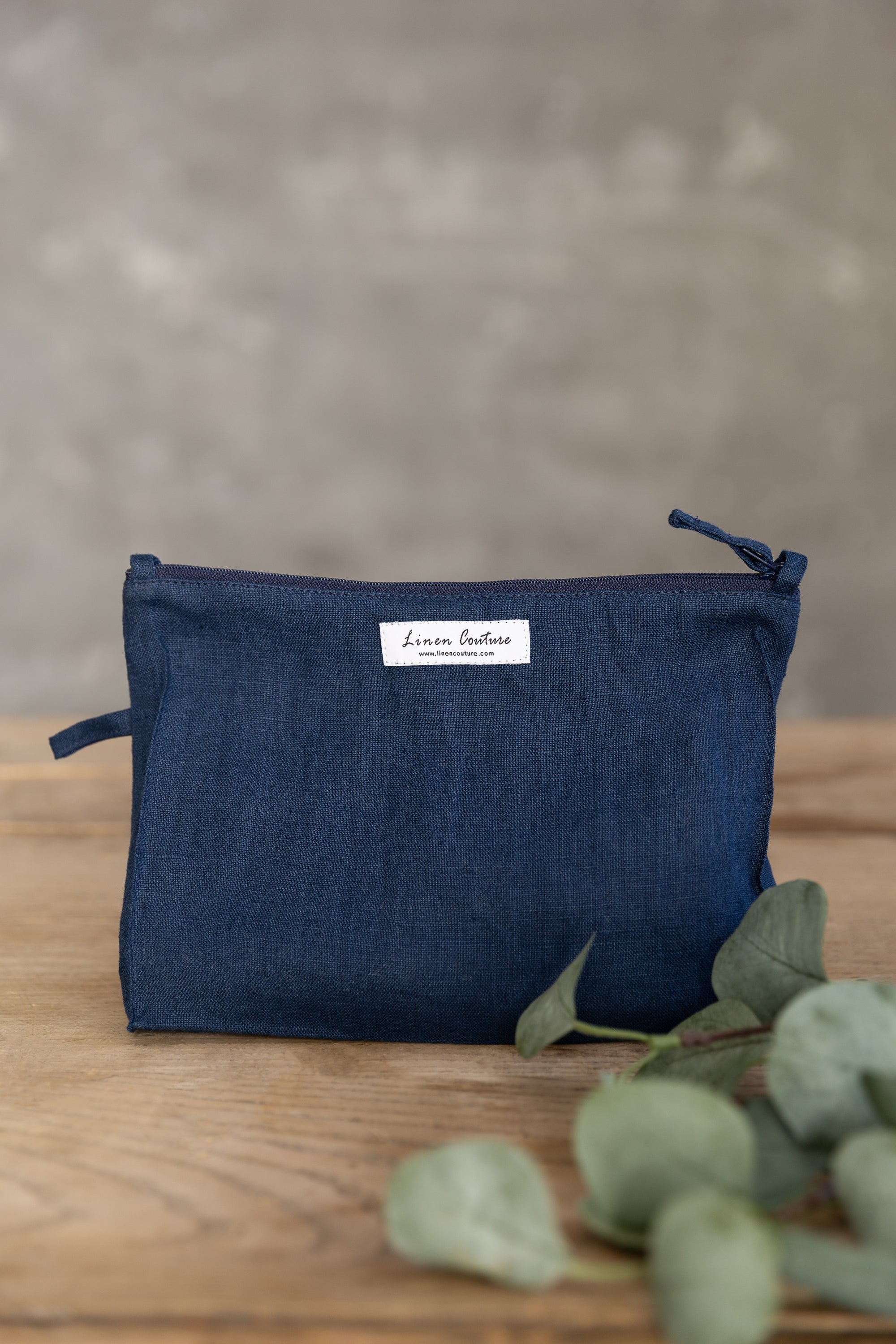 Night Blue linen large makeup bag with zipper, showcasing its elegant design and practical size for organizing essentials.