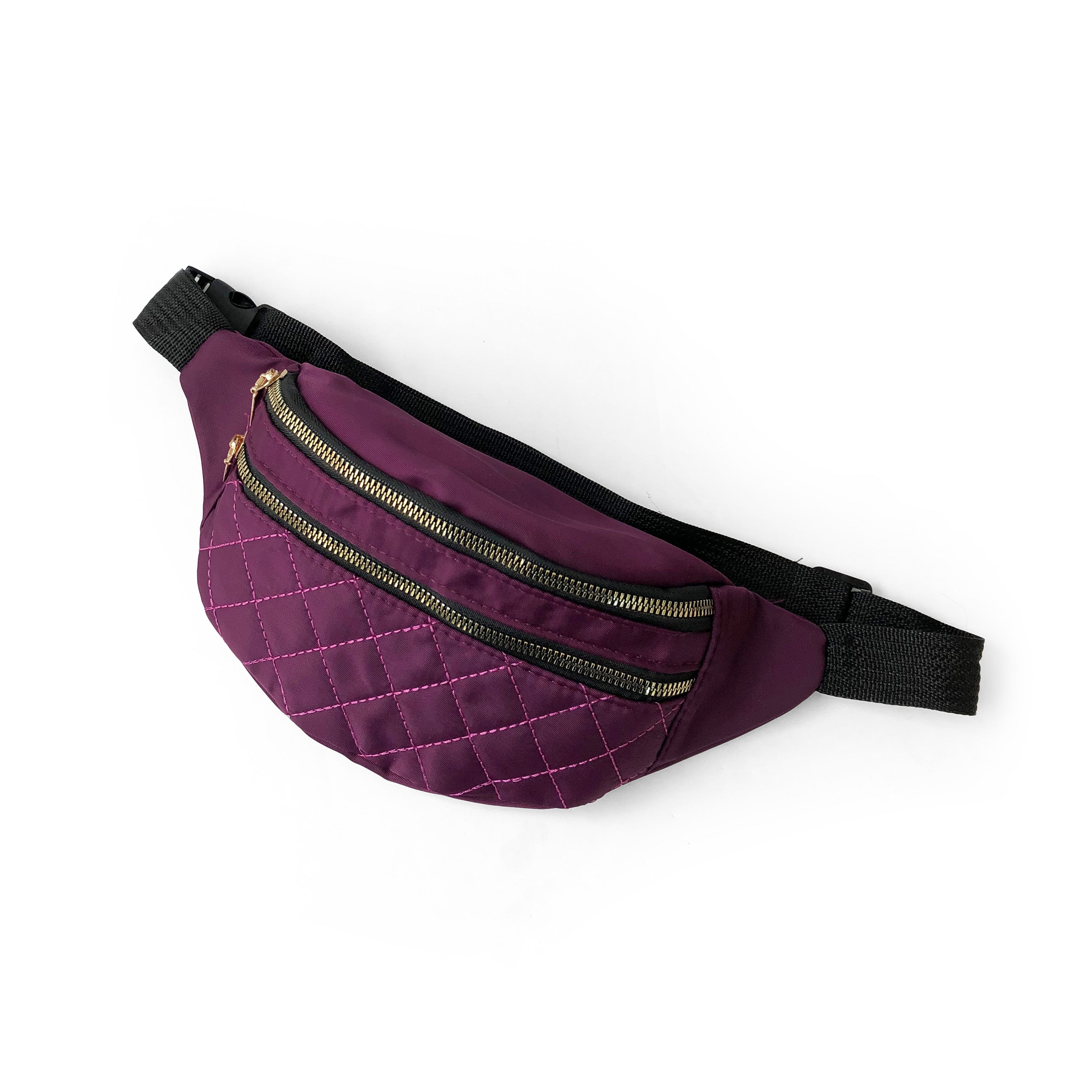 Nicci Quilted Waistbag in lightweight nylon with gold tone hardware, featuring adjustable strap and multiple zip compartments.