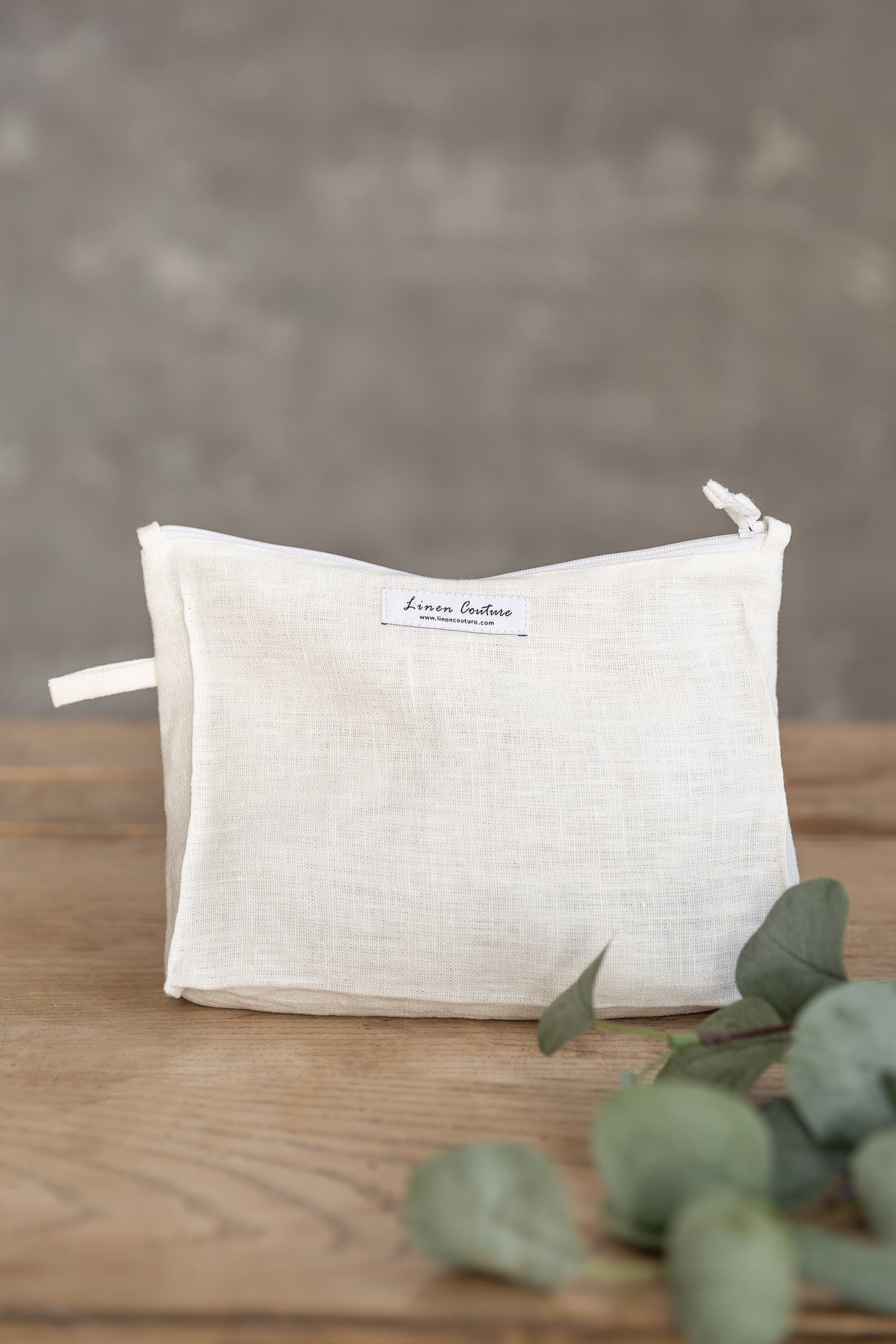 Elegant white linen large makeup bag with zipper, showcasing its spacious interior and soft texture, perfect for organizing cosmetics and toiletries.