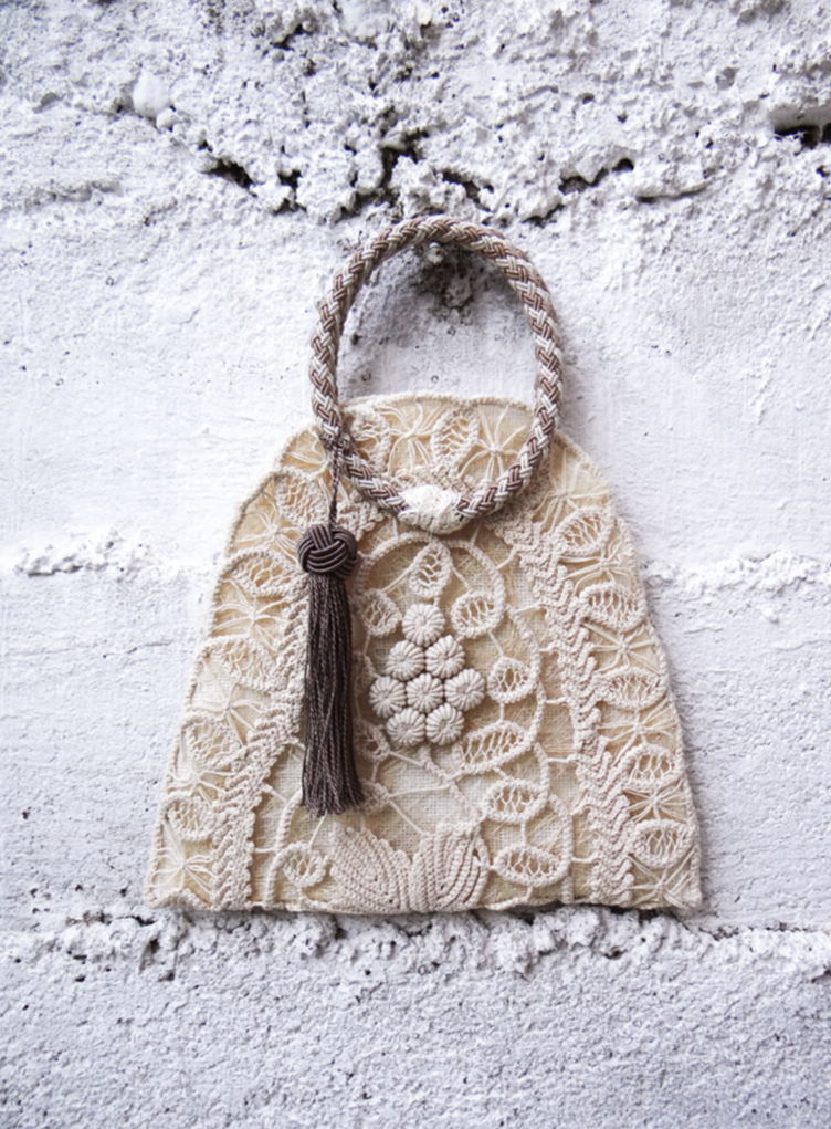 ANGLEZ n.3 handmade bag featuring traditional embroidery, linen lining, and a brown tassel.