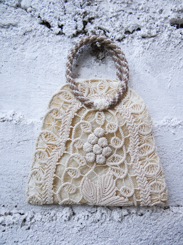 ANGLEZ n.3 handmade bag featuring traditional embroidery, linen lining, and a brown tassel.