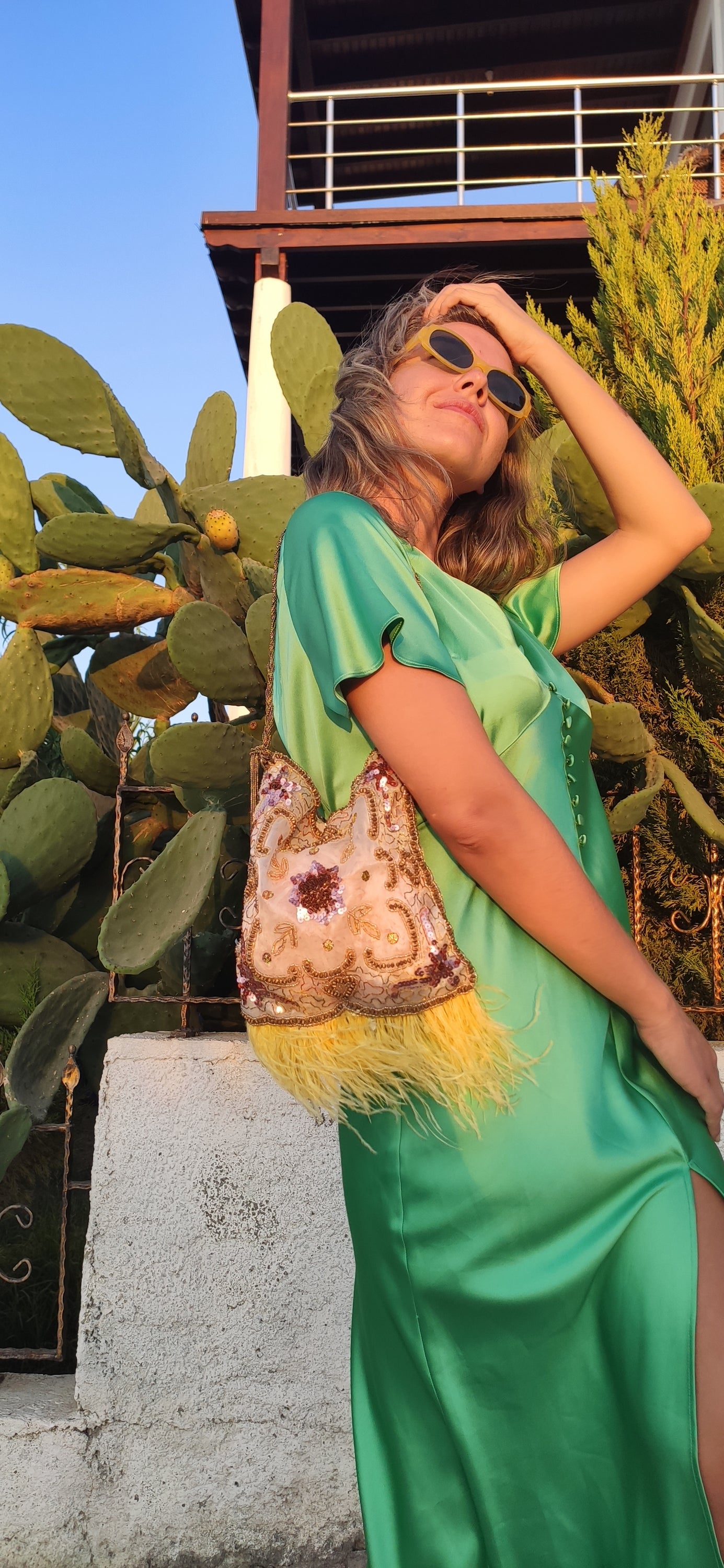 Antique transparent tulle bag with self-embroidery and yellow feathers, featuring a vintage cord handle.