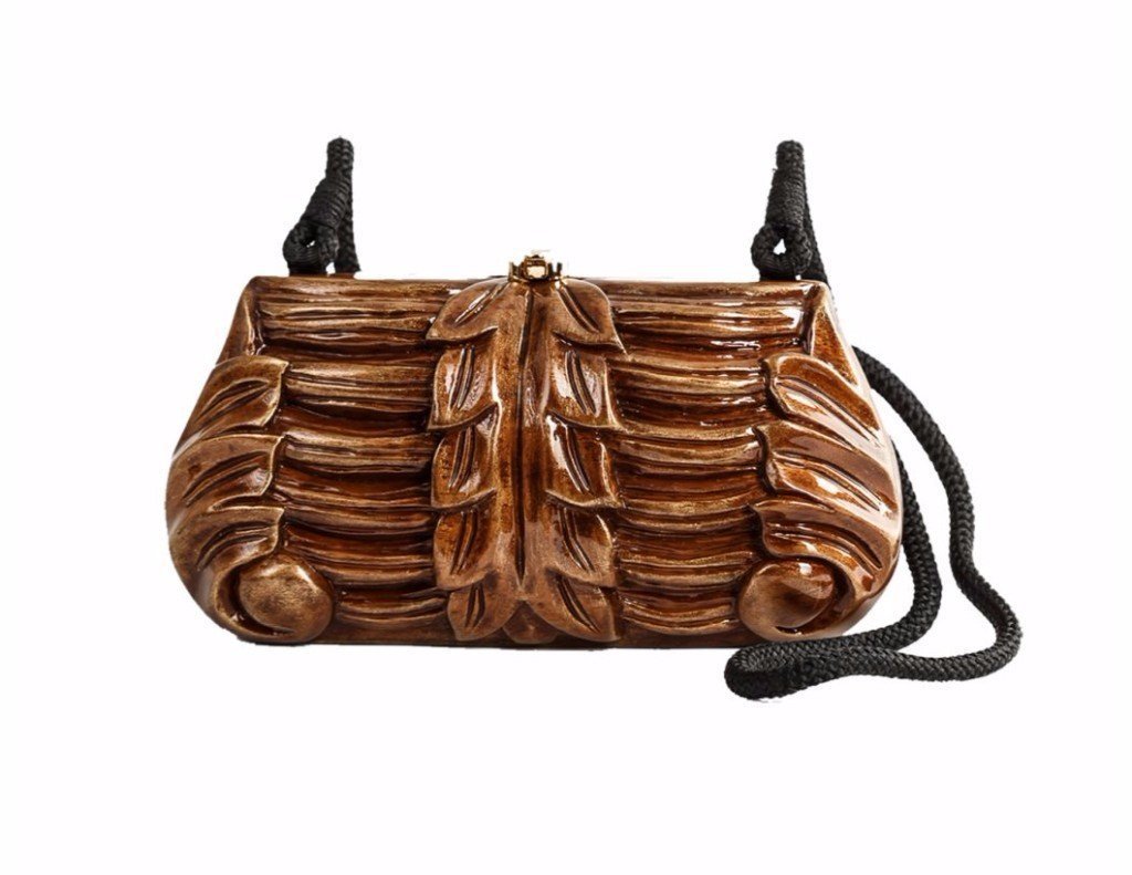 Athena Handbag featuring hand-carved Acacia wood with golden accents and a TW lock, showcasing its elegant design and versatility.