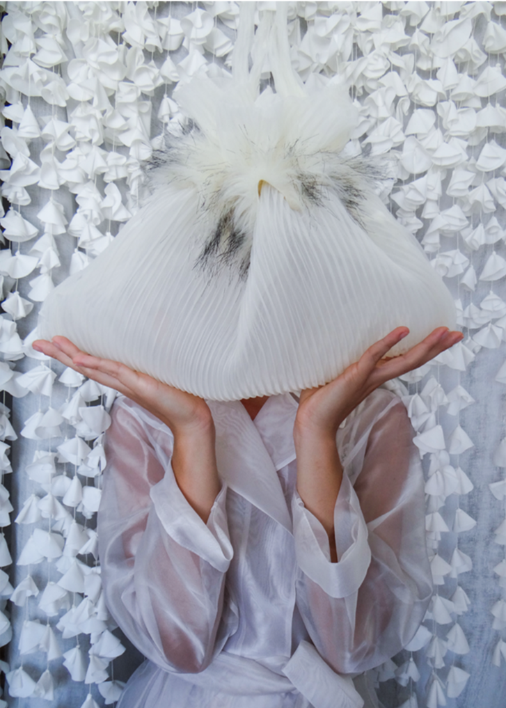 Stylish BRIDAL bag made from pleated chiffon with ecru-black fur decoration, showcasing modern upcycling.