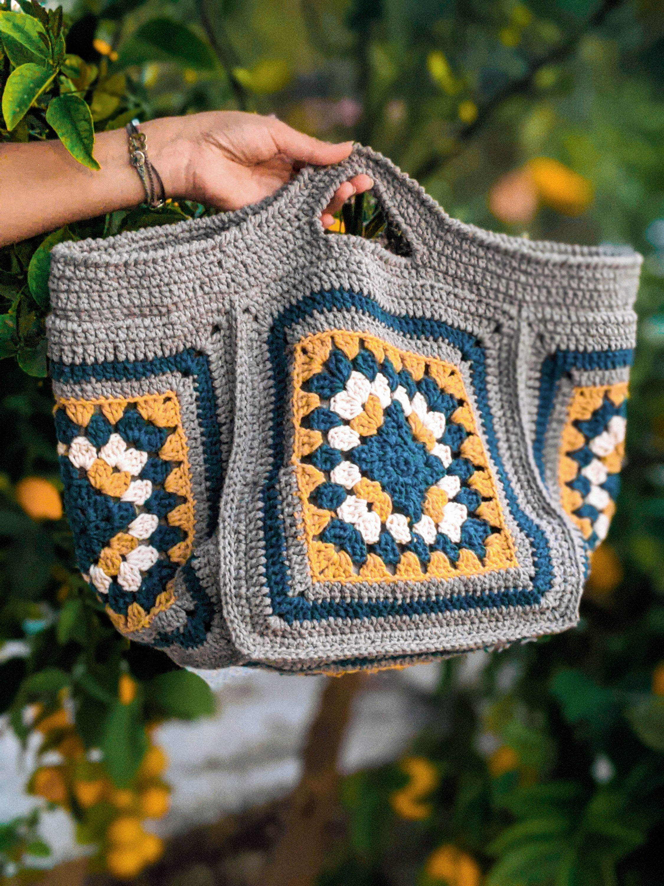 Handmade Bumblebee Jasper bag featuring grey, dark blue, mustard, and off-white colors, measuring 45 cm x 17 cm.