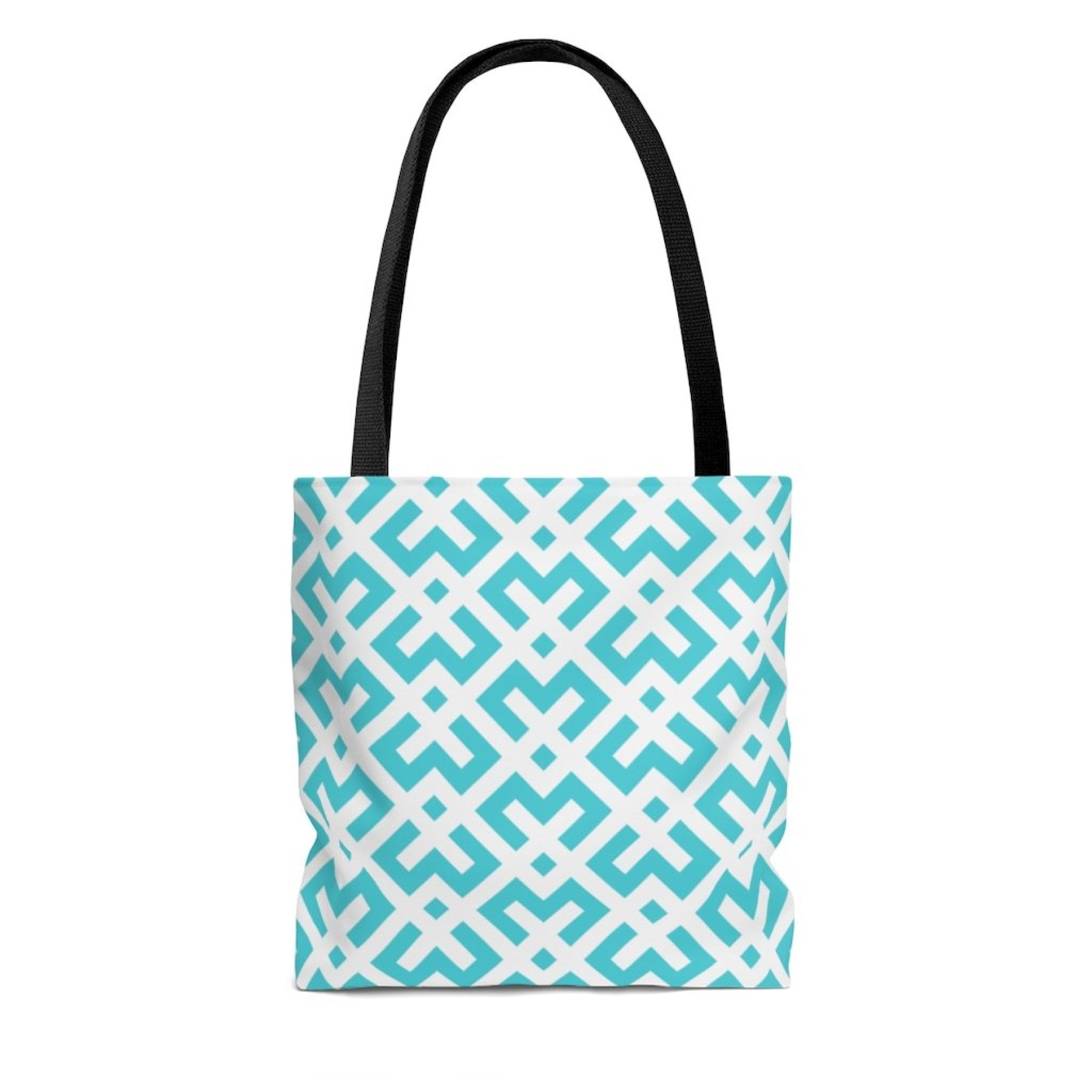 Green and white geometric canvas tote bag with black handles and lining, perfect for stylish outings.