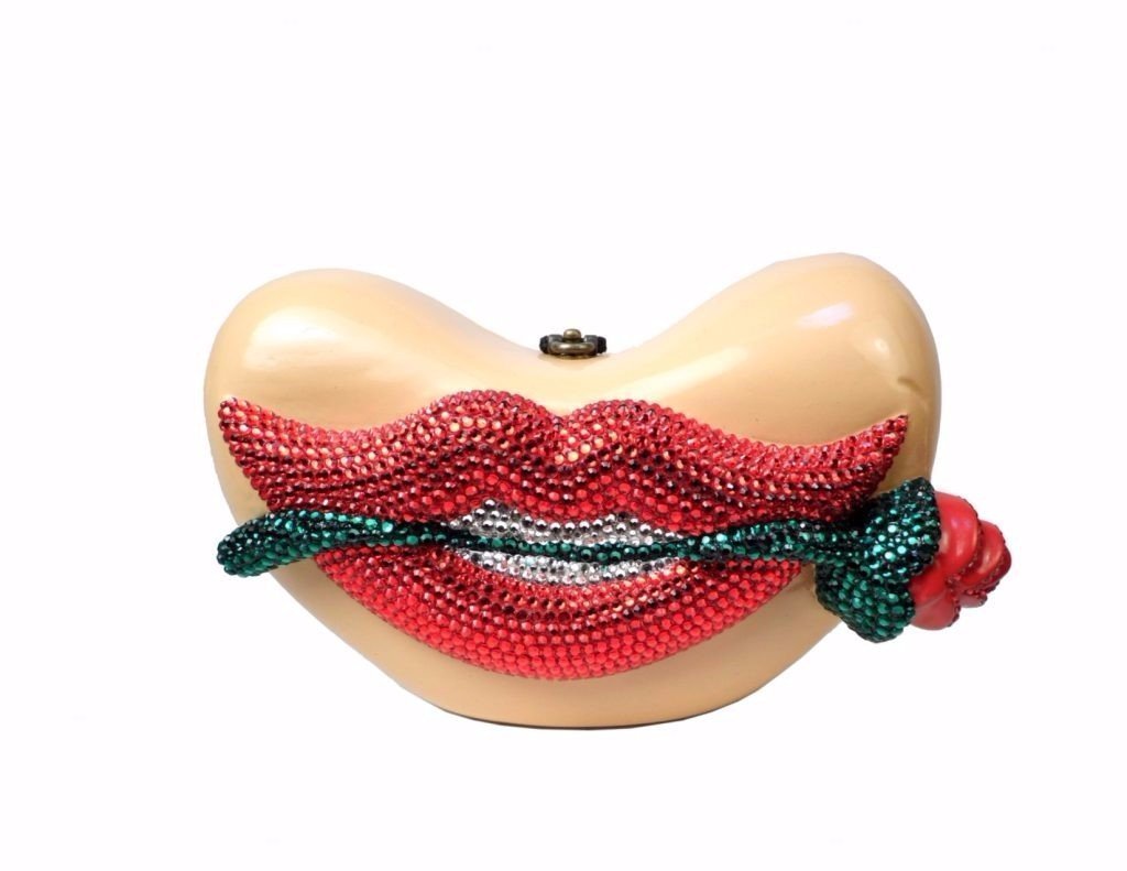 Carmen Lips handbag featuring hand-painted Acacia wood, red lips, and Swarovski crystals, showcasing a 3-D rose design.