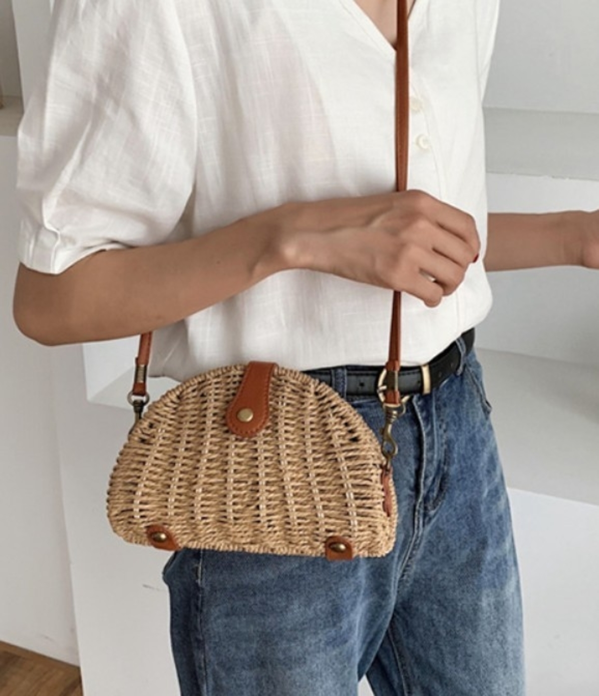 A stylish Casual Mini Oval Straw Crossbody Bag in khaki color, made from wicker straw, featuring an adjustable strap and chic oval design.