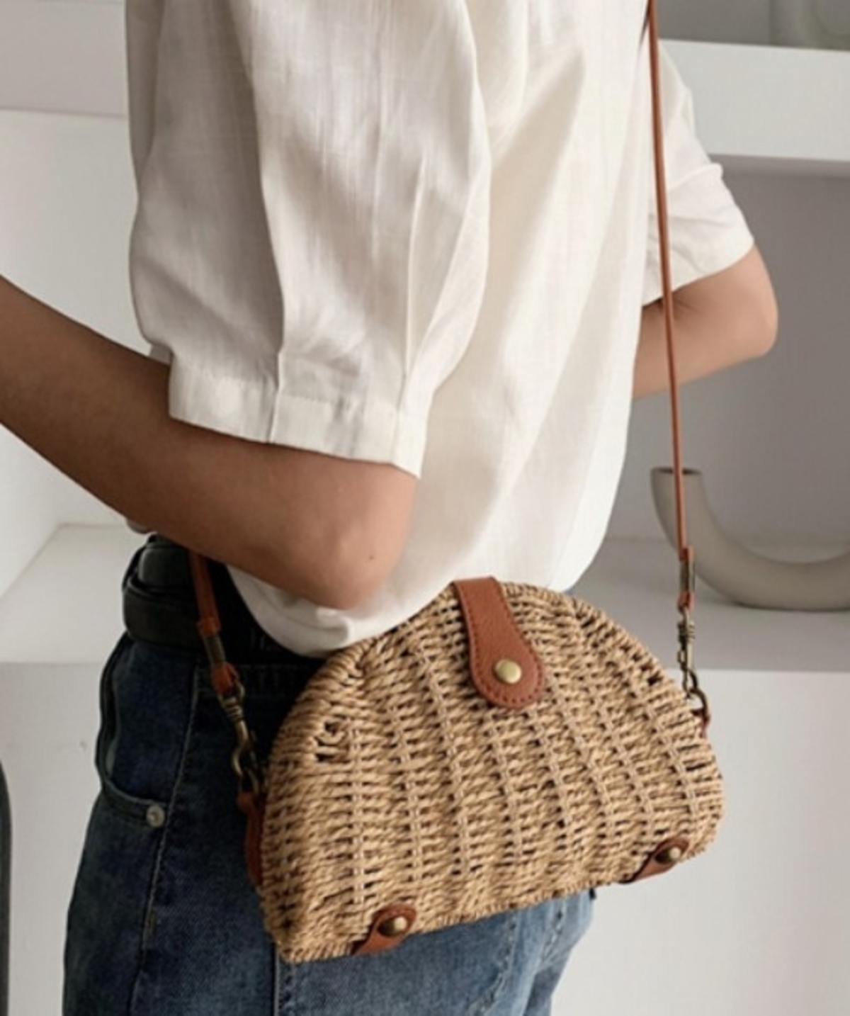 A stylish Casual Mini Oval Straw Crossbody Bag in khaki color, made from wicker straw, featuring an adjustable strap and chic oval design.