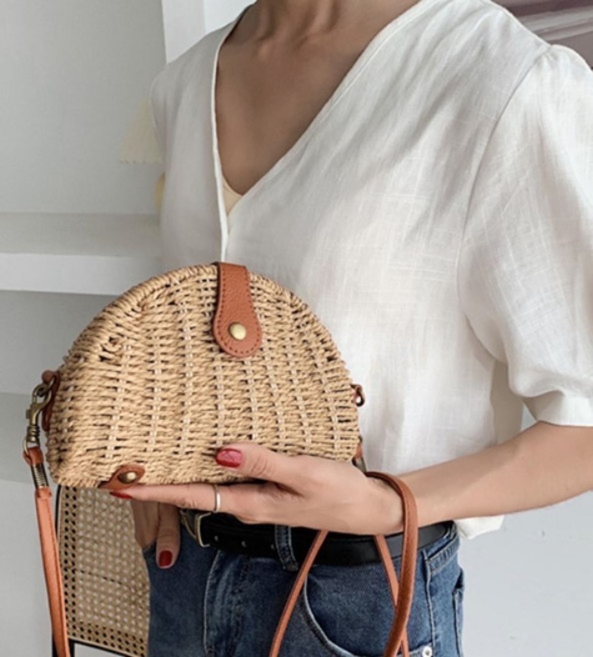 A stylish Casual Mini Oval Straw Crossbody Bag in khaki color, made from wicker straw, featuring an adjustable strap and chic oval design.