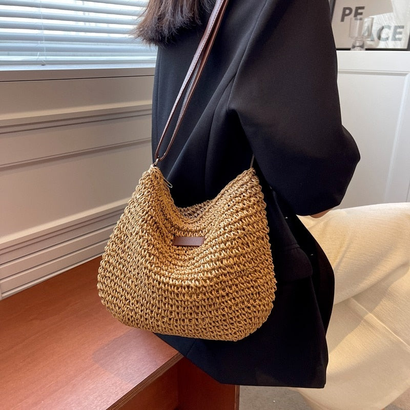 Casual Summer Shoulder Straw Bag made of woven straw with a chic shoulder strap, perfect for beach days.