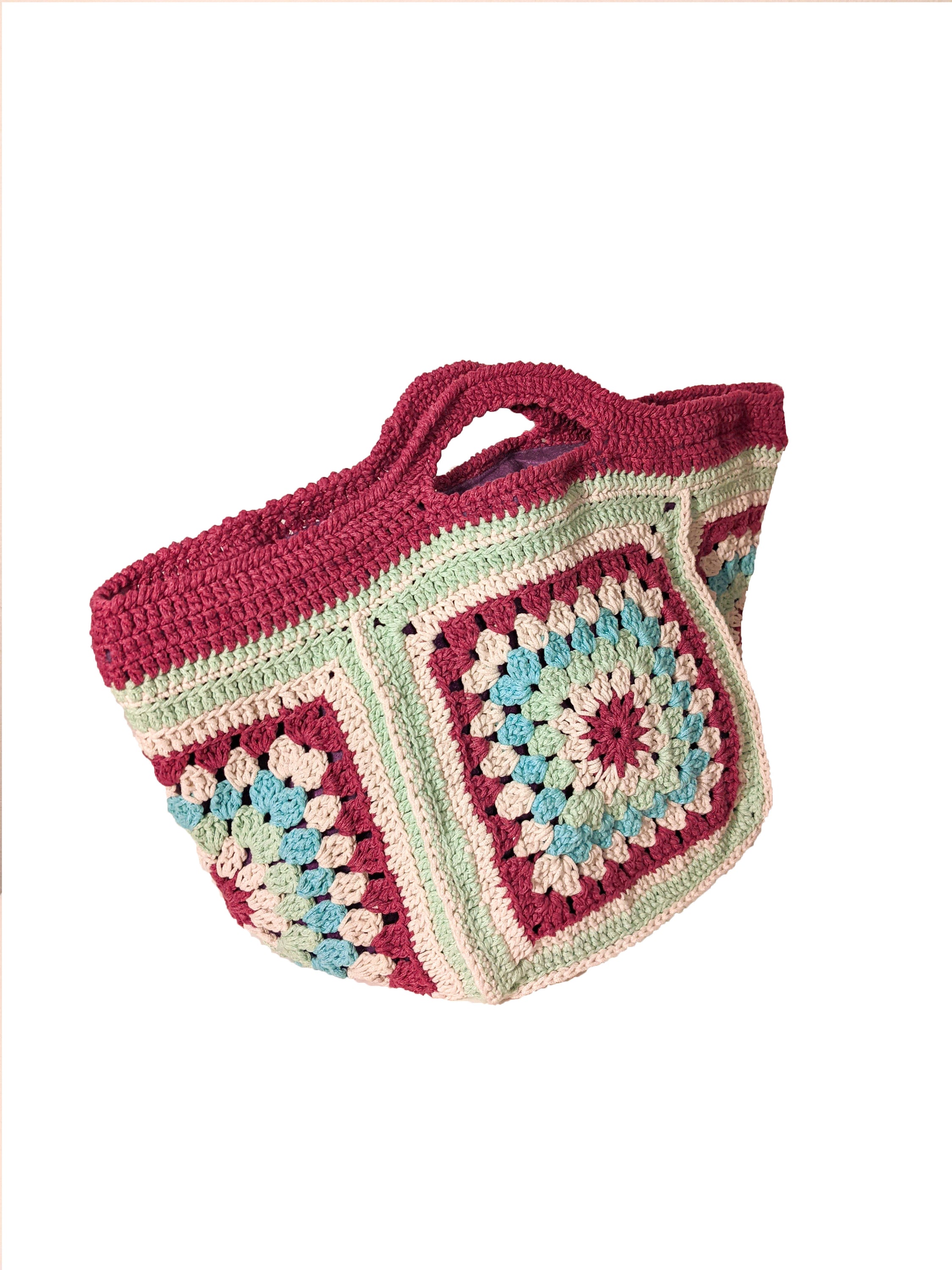 Handmade knit bag in burgundy, aqua, aquamarine, and off-white colors, measuring 45 cm x 17 cm.