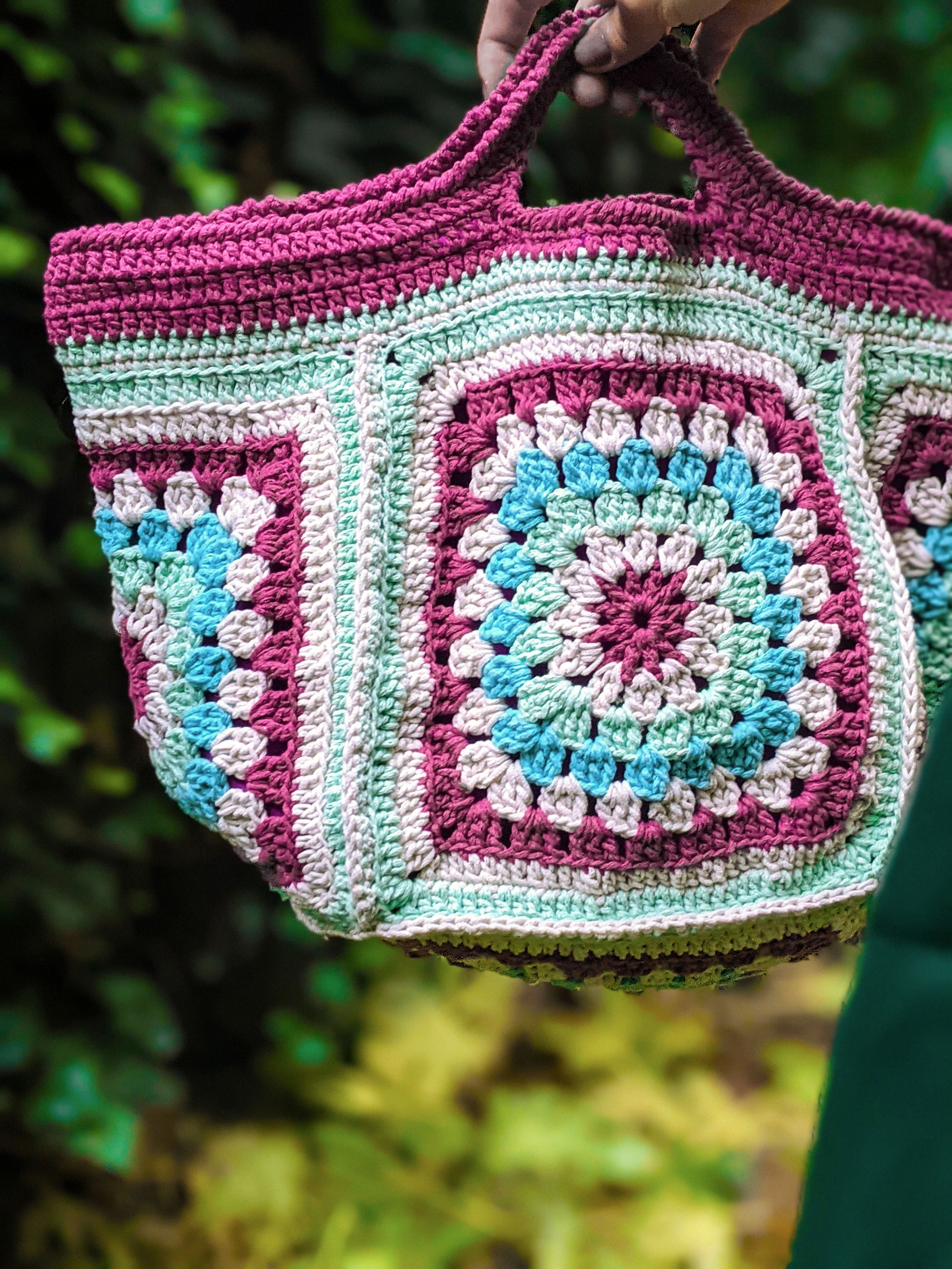 Handmade knit bag in burgundy, aqua, aquamarine, and off-white colors, measuring 45 cm x 17 cm.