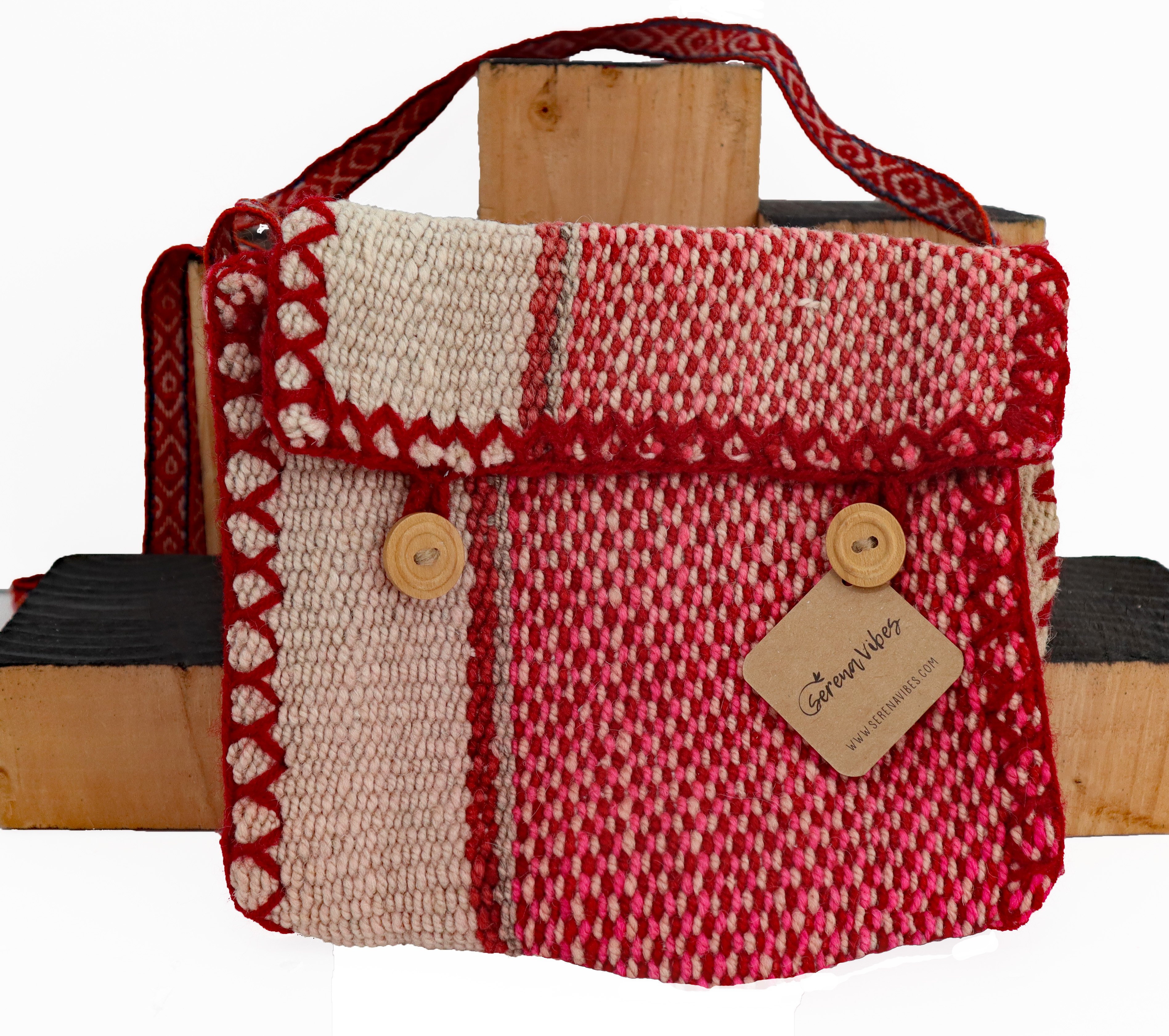 A stylish cross body button purse handcrafted by Peruvian artisans, featuring a lightweight alpaca blend strap and vibrant natural dye colors.