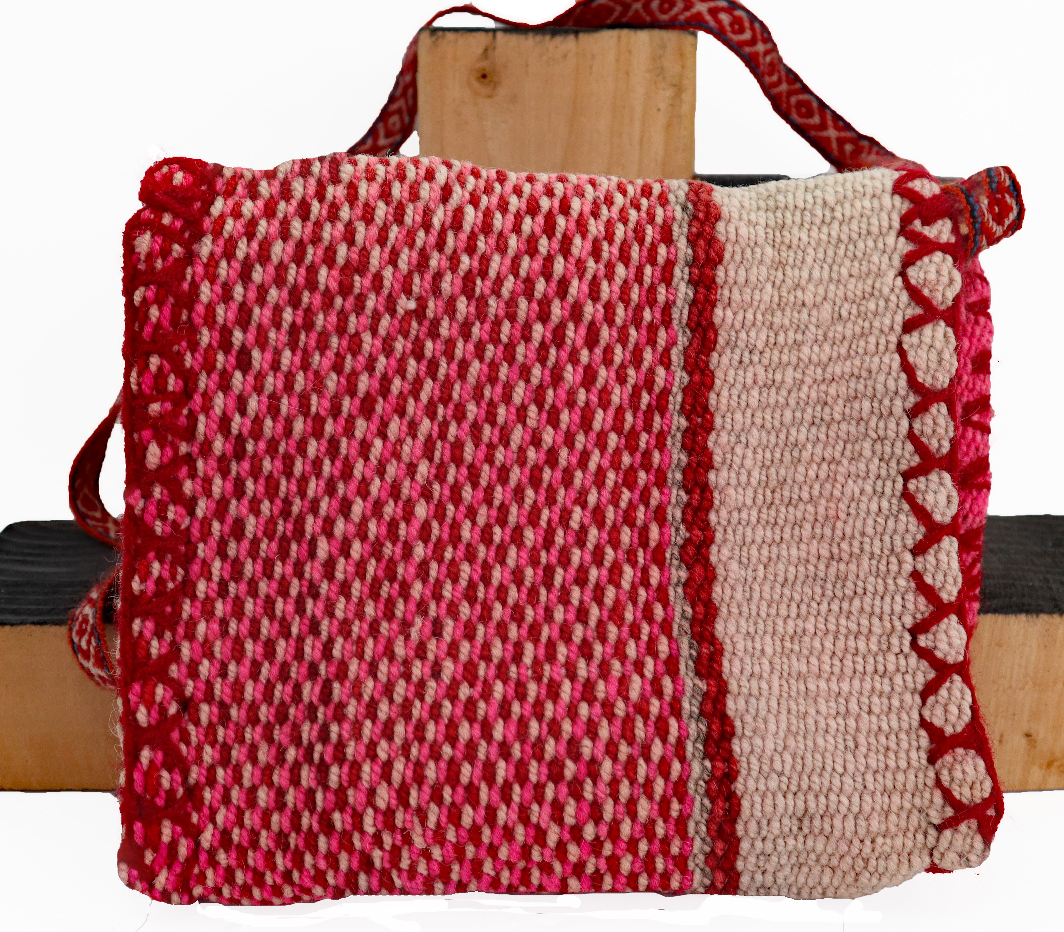 A stylish cross body button purse handcrafted by Peruvian artisans, featuring a lightweight alpaca blend strap and vibrant natural dye colors.