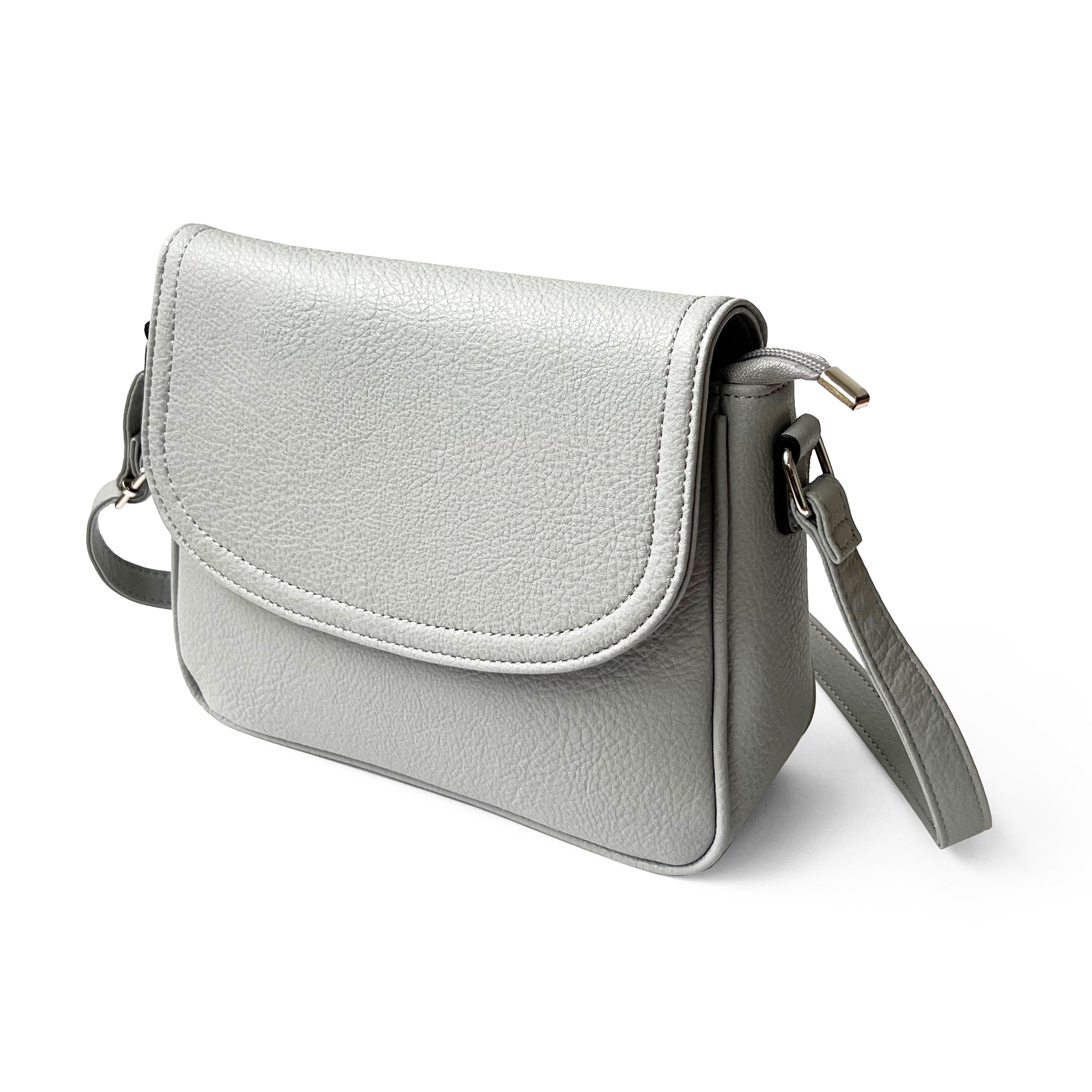 Stylish crossbody bag with rounded front flap, made from pebble PU, featuring adjustable strap and multiple pockets.