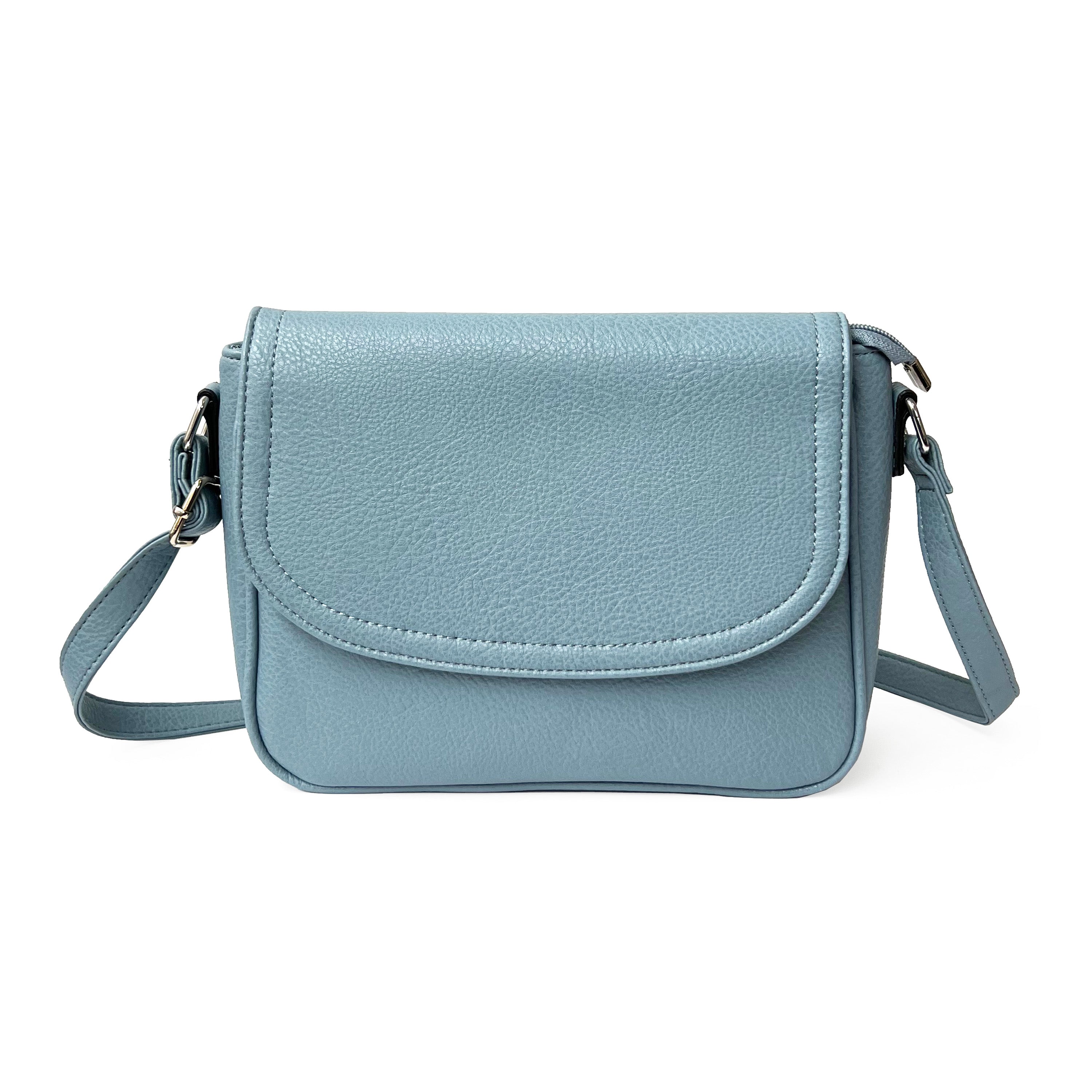 Stylish crossbody bag with rounded front flap, made from pebble PU, featuring adjustable strap and multiple pockets.