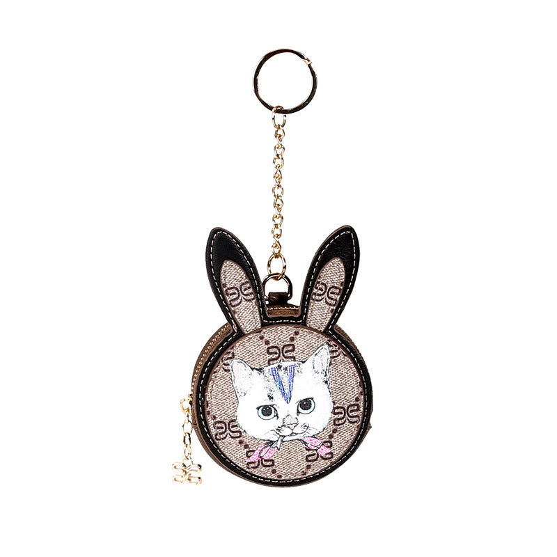 Cute mini cat purse coin bag for children made of genuine leather with gold fittings, perfect for storing coins and small items.