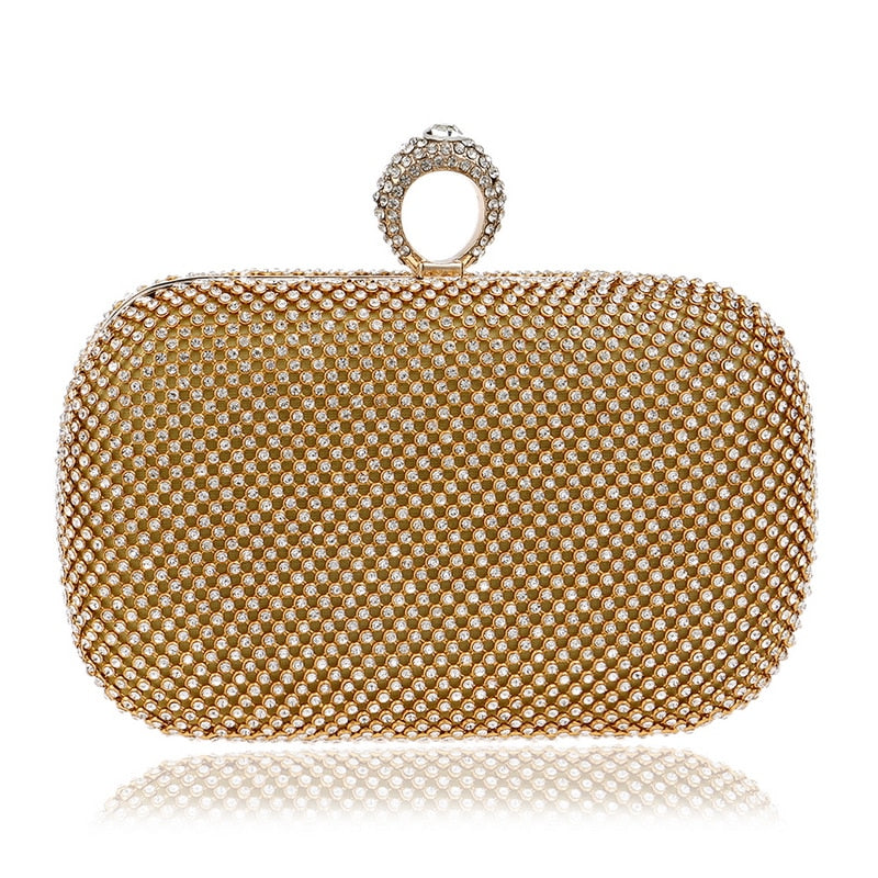 Elegant diamond-studded evening clutch bag with a chain shoulder strap, perfect for weddings and formal events.