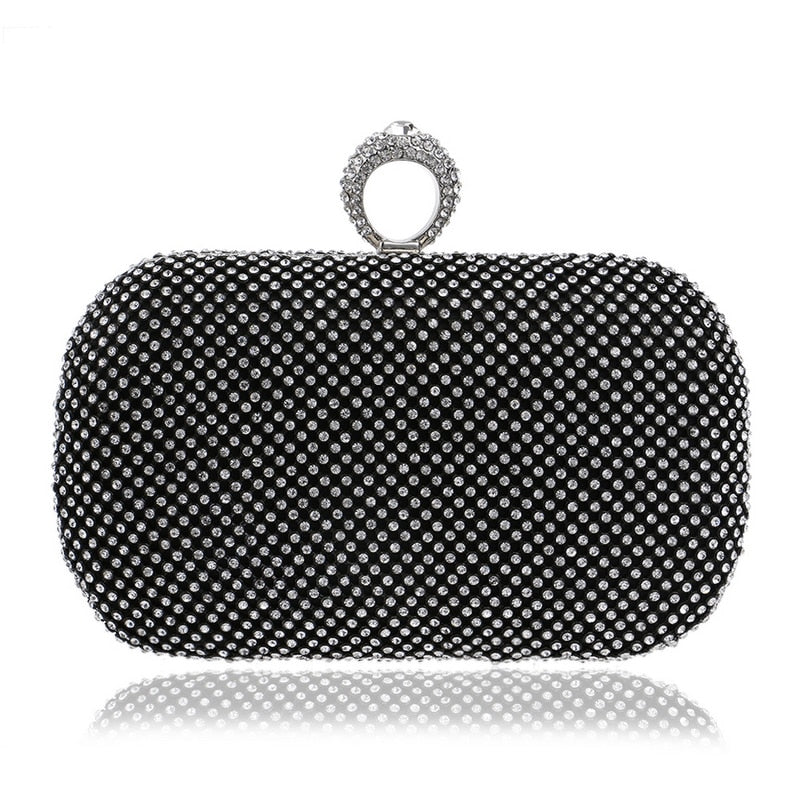 Elegant diamond-studded evening clutch bag with a chain shoulder strap, perfect for weddings and formal events.