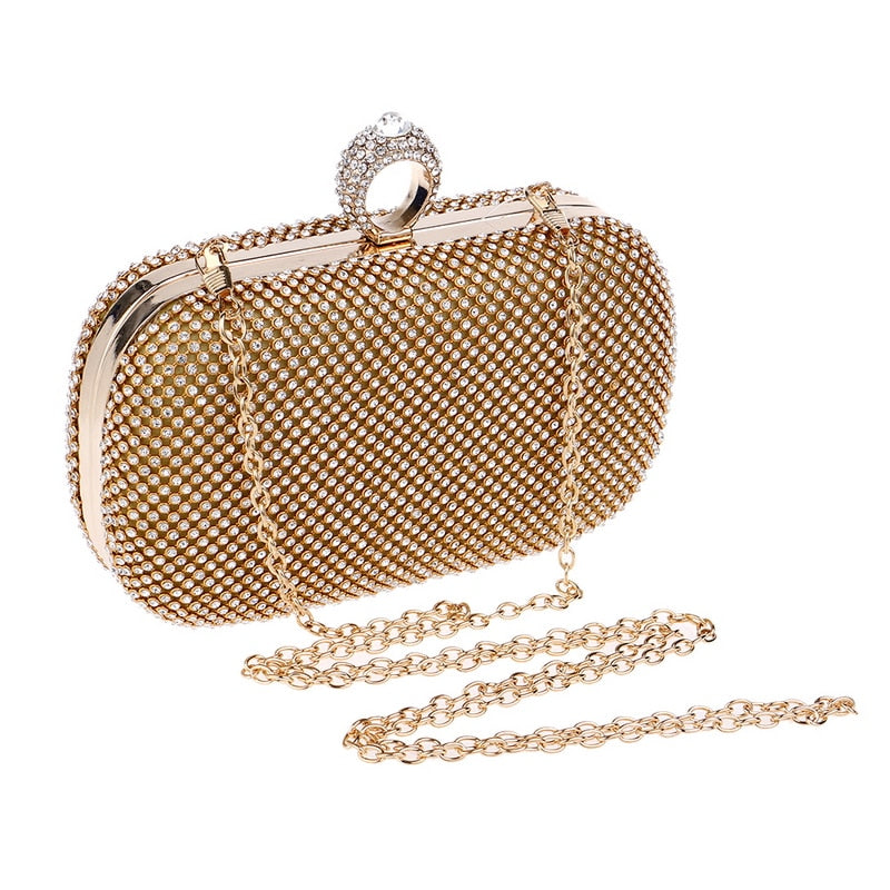 Elegant diamond-studded evening clutch bag with a chain shoulder strap, perfect for weddings and formal events.