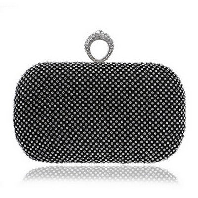 Elegant diamond-studded evening clutch bag with a chain shoulder strap, perfect for weddings and formal events.