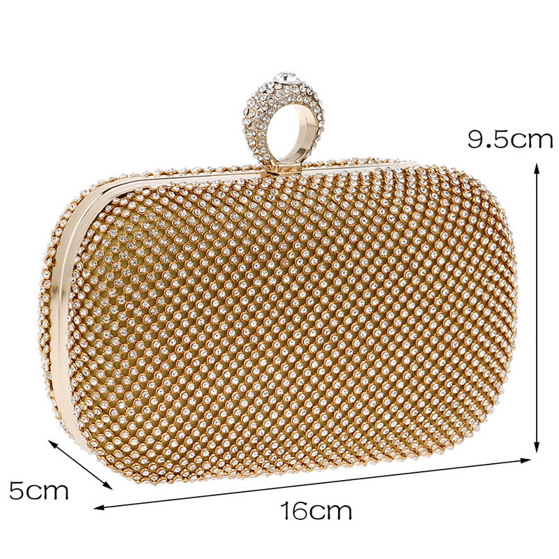 Elegant diamond-studded evening clutch bag with a chain shoulder strap, perfect for weddings and formal events.