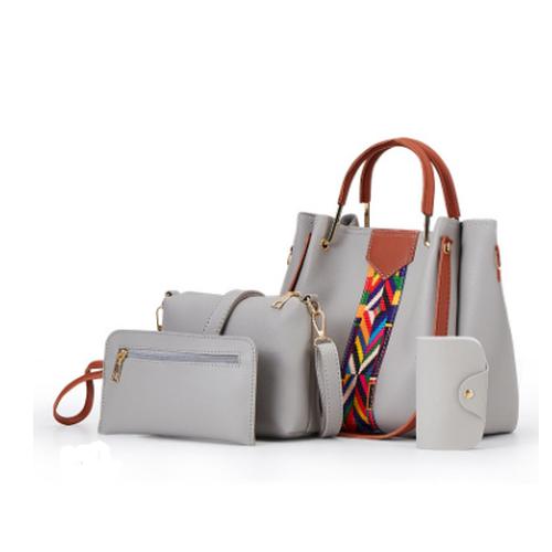 A stylish collection of four women's handbags in various colors and designs, showcasing their soft texture and practical features.