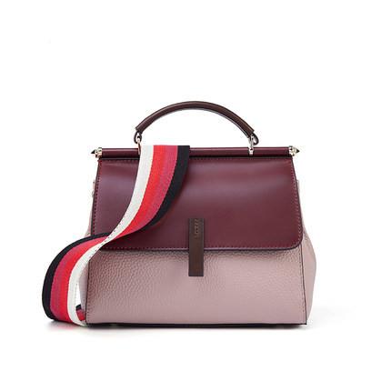 A stylish Female Fashion Color Contrast Shoulder Bag made from two-layer cowhide, featuring a shell shape, zipper buckle opening, and a wide shoulder strap.