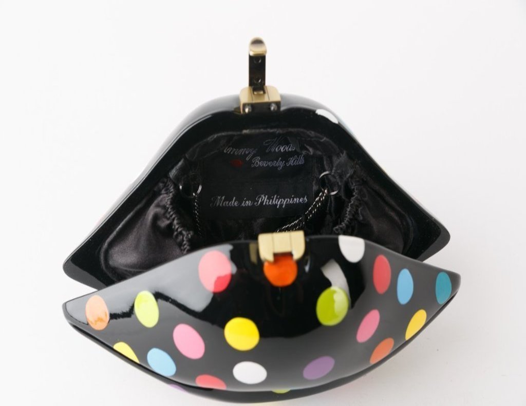 Gaga Mini Lips handbag featuring vibrant multi-color fashion dots and red lips detail, with a black comfy cord for easy carrying.