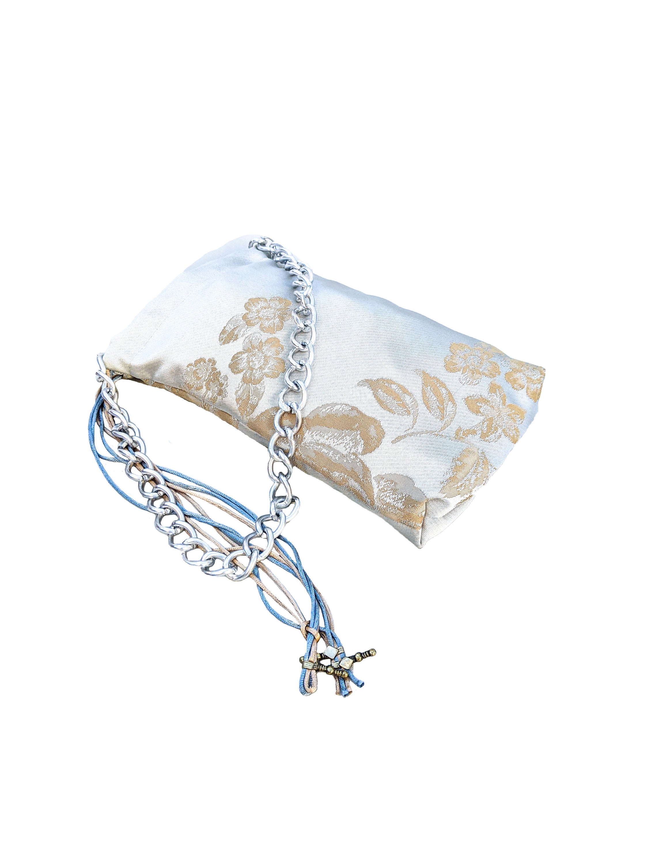 Stylish grey sateen pouch shoulder bag featuring a metal chain handle and shiny brown and ice blue strings.